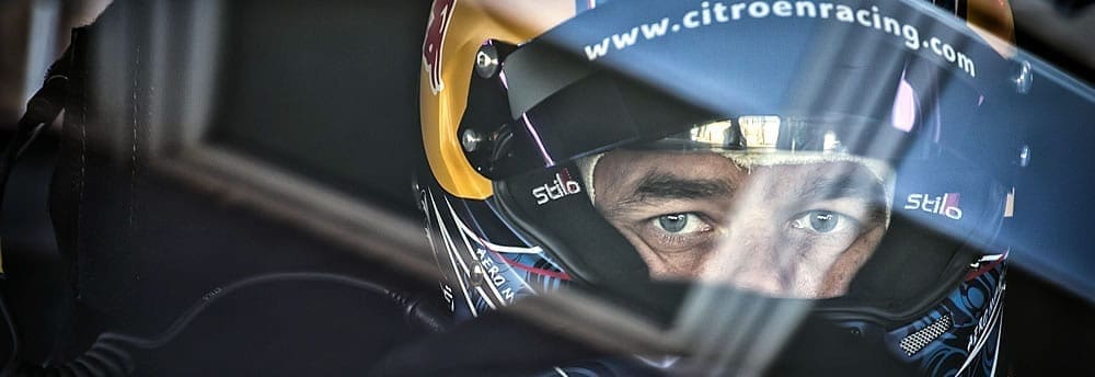 Loeb vence bateria interrompida pela chuva