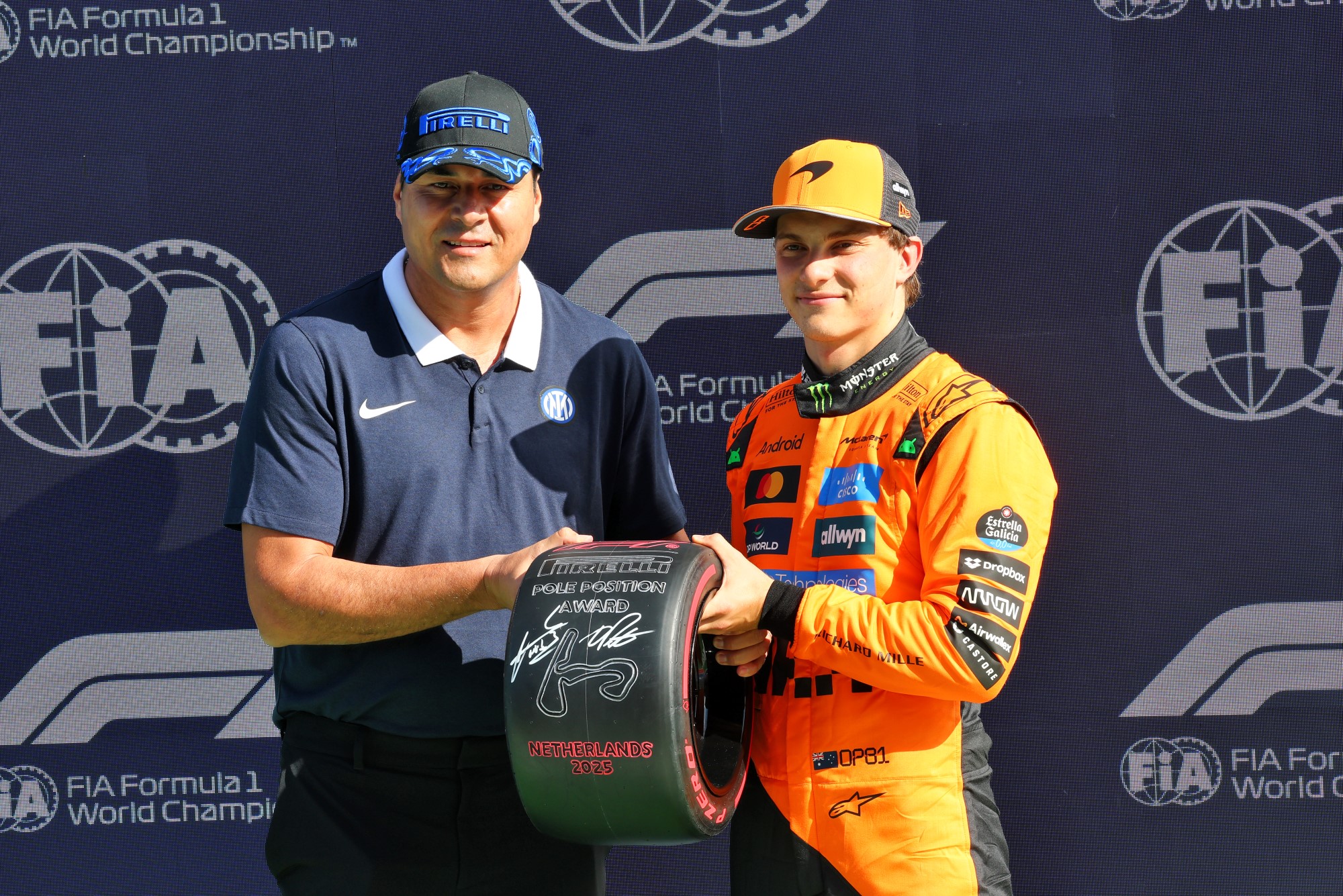 (L to R): Julio Ricardo Cruz (ARG) Former Football Player presents the Pirelli Pole Position Award to Oscar Piastri (AUS) McLaren in qualifying parc ferme.
