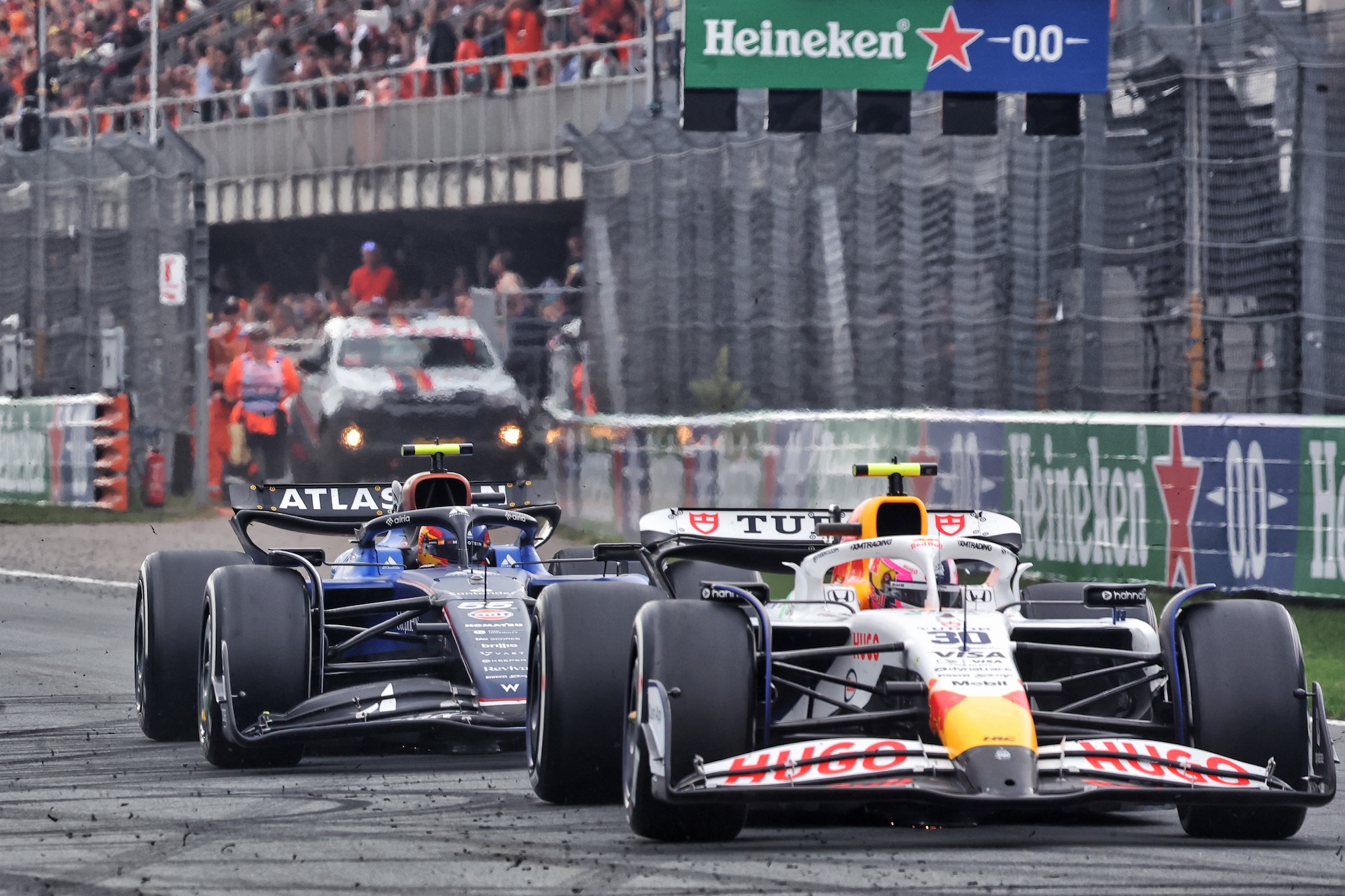 Liam Lawson (NZL) Racing Bulls VCARB 02 and Carlos Sainz (ESP) Atlassian Williams Racing FW47 makes a pit stop.