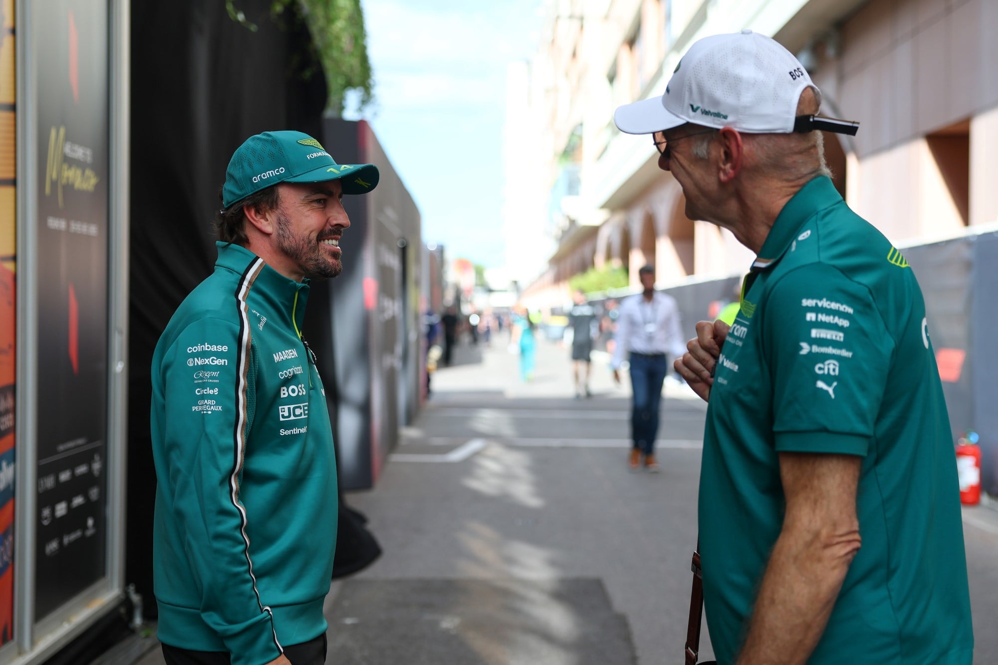 MONTE-CARLO, MONACO - MAY 22: Fernando Alonso of Spain and Aston Martin F1 Team talks with Adrian Newey, Managing Technical Partner of Aston Martin F1 in the Paddock during previews ahead of the F1 Grand Prix of Monaco at Circuit de Monaco on May 22, 2025 in Monte-Carlo, Monaco. (Photo by Zak Mauger/LAT Images)