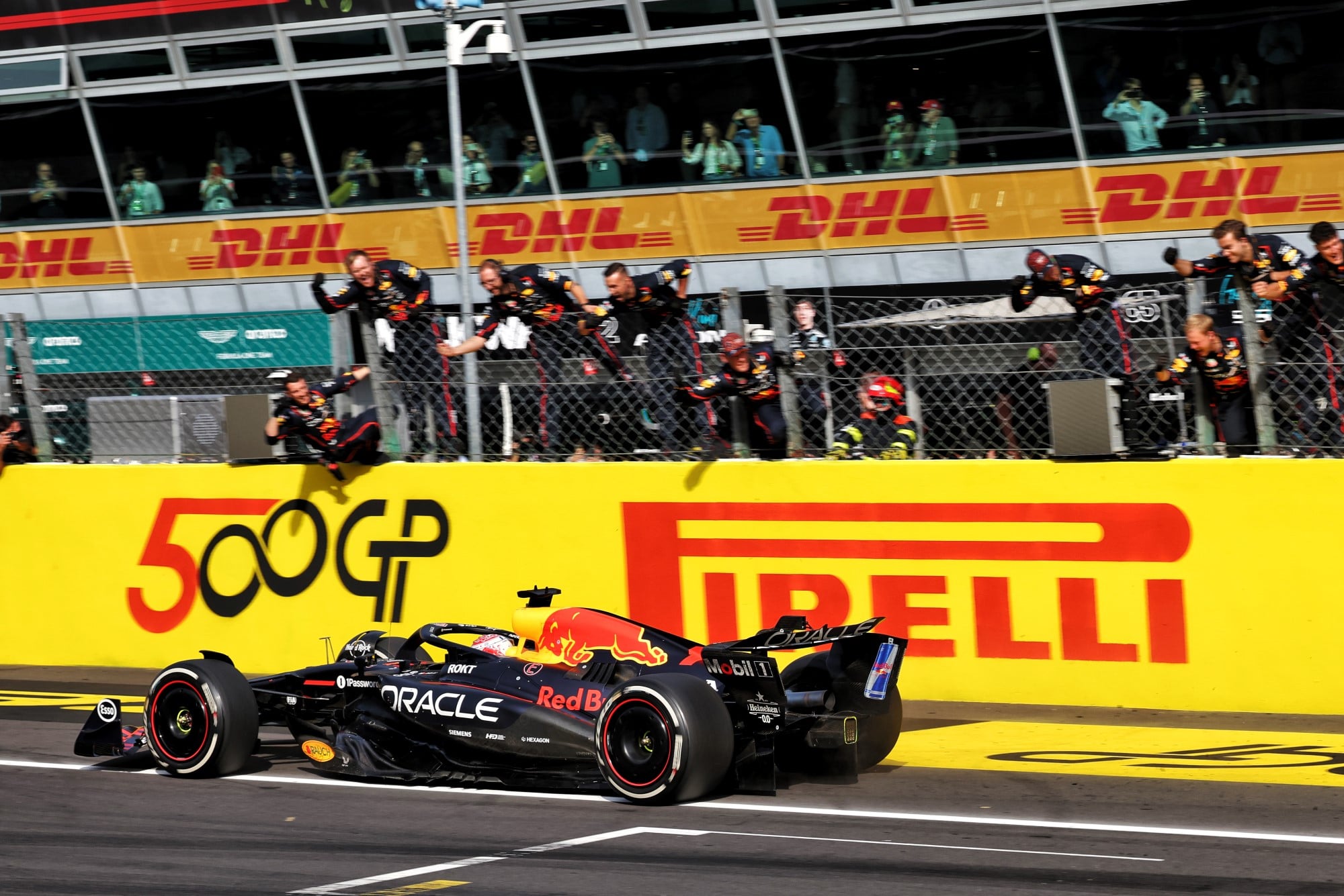 Race winner Max Verstappen (NLD) Red Bull Racing RB21 passes the team at the end of the race.