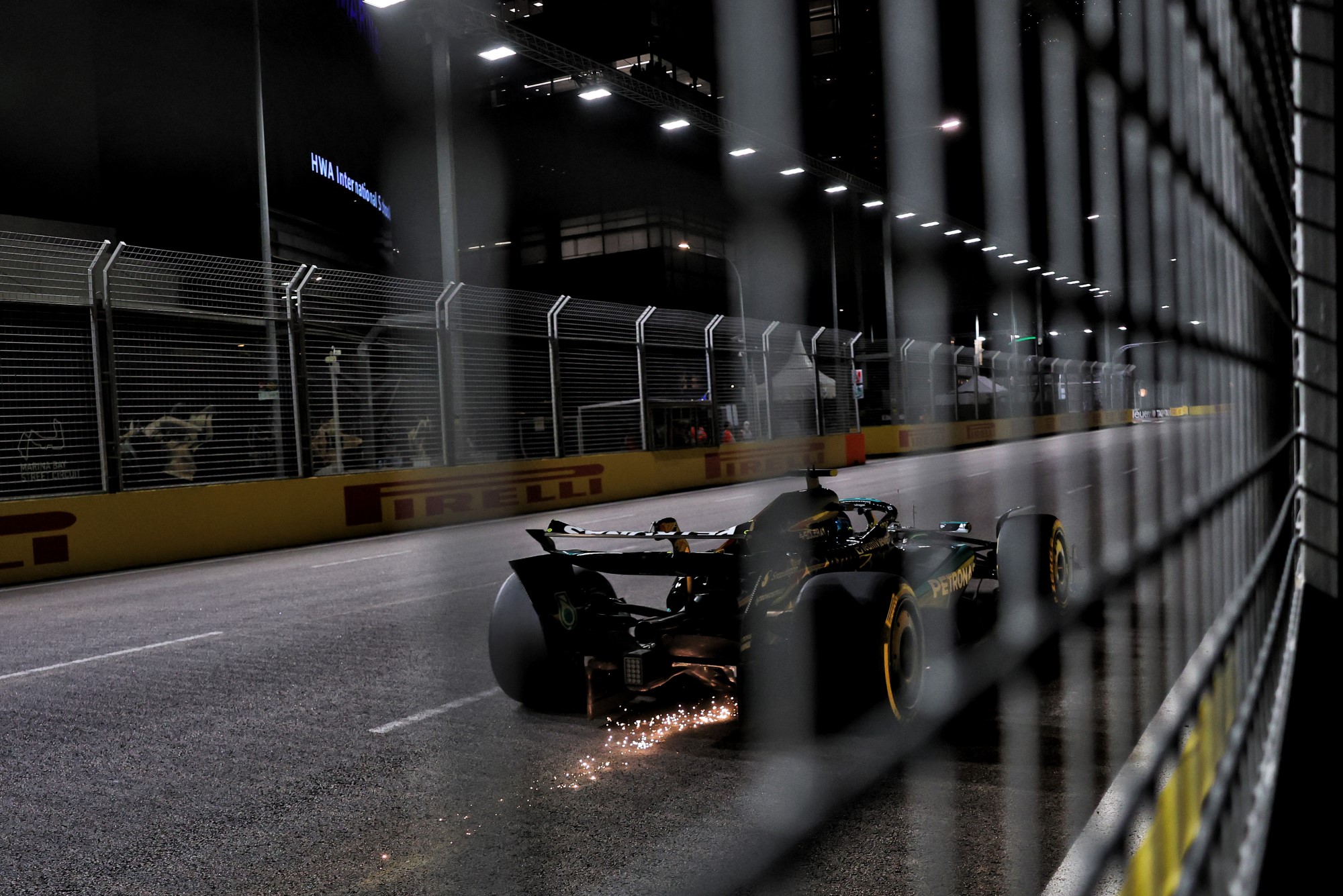George Russell (GBR) Mercedes AMG F1 W16 sends sparks flying.