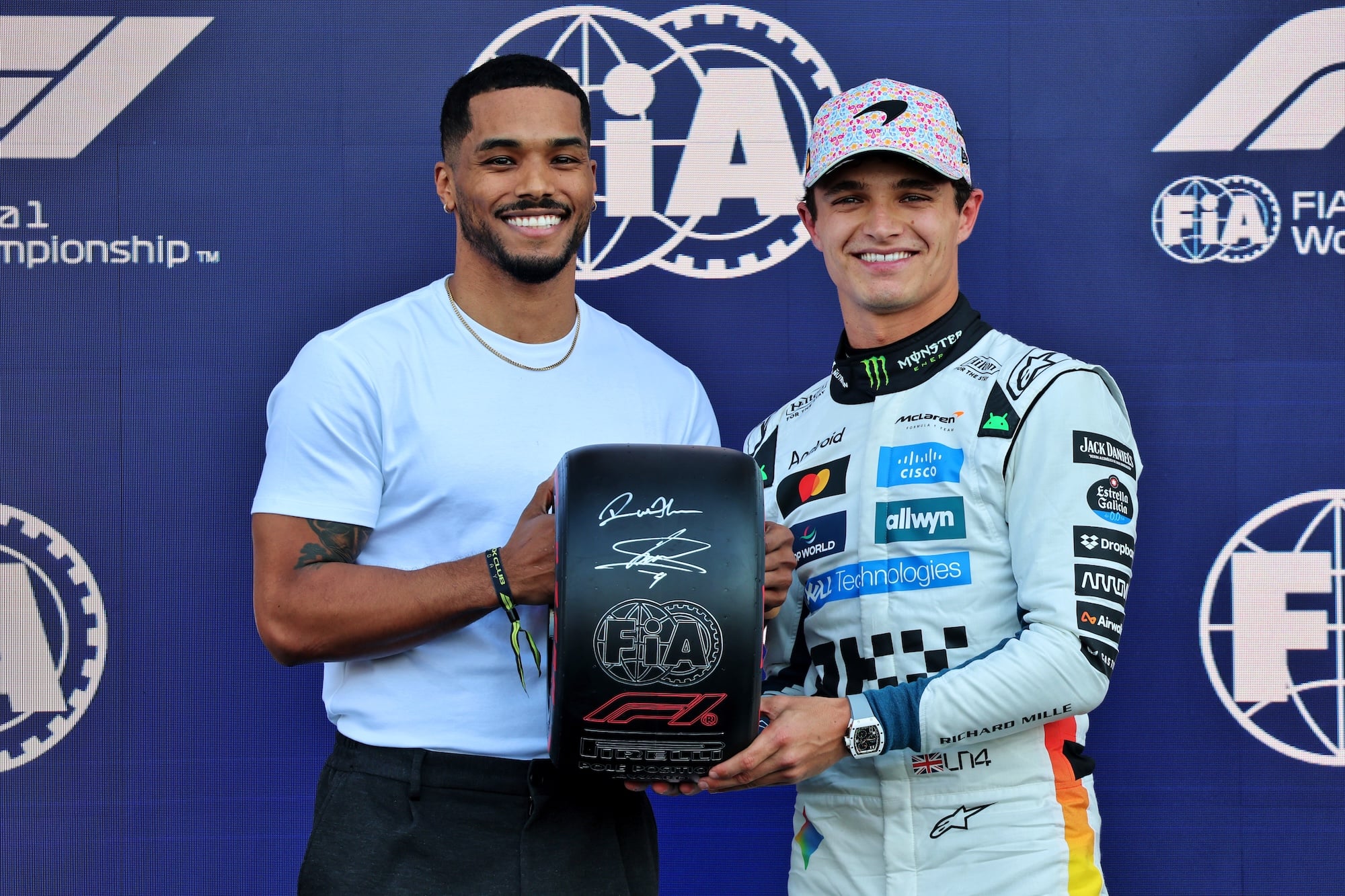 (L to R): Rome Flynn (USA) Actor presents the Pirelli Pole Position Award to Lando Norris (GBR) McLaren in qualifying parc ferme.