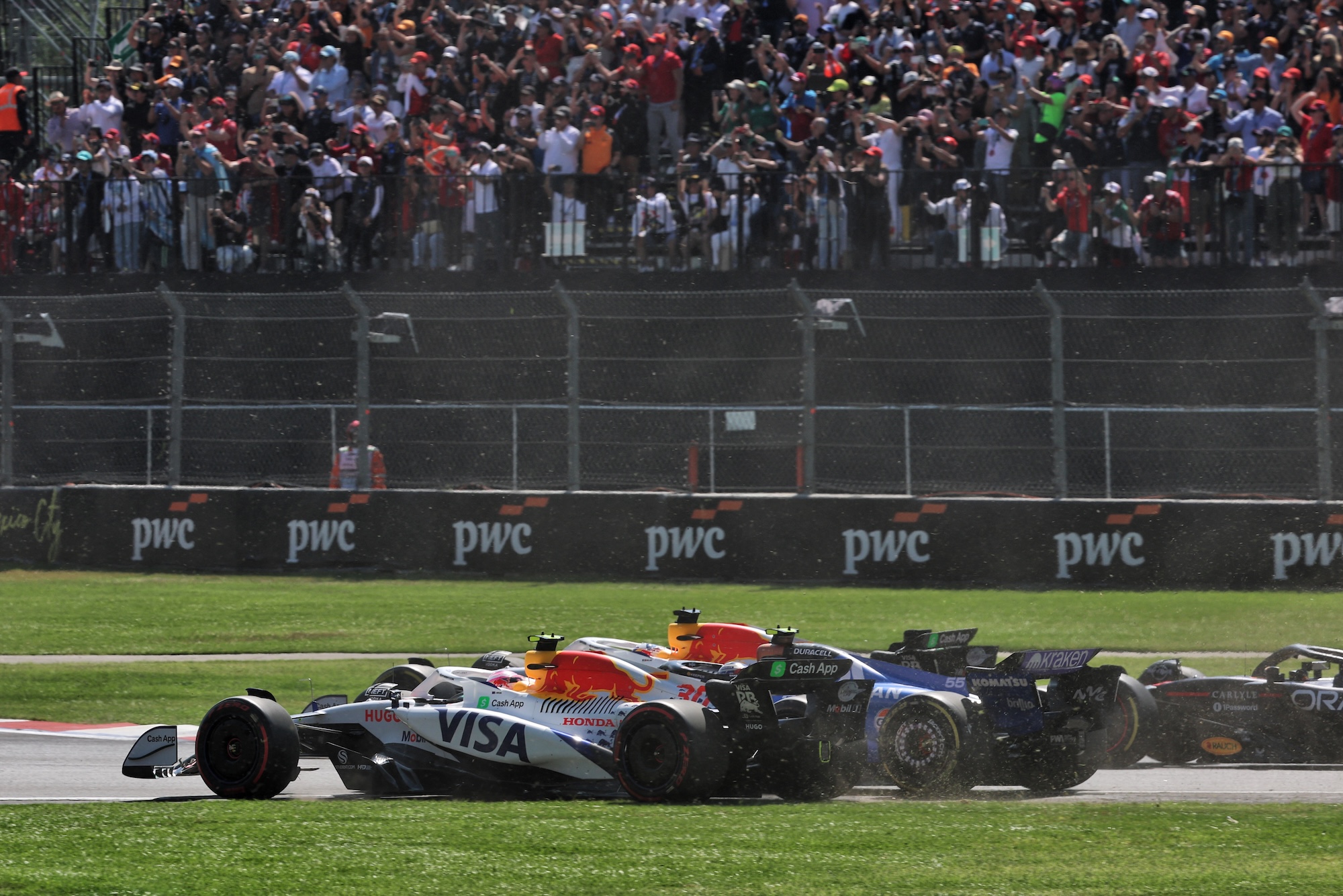 Carlos Sainz (ESP) Atlassian Williams Racing FW47 and Liam Lawson (NZL) Racing Bulls VCARB 02 run wide at the start of the race.