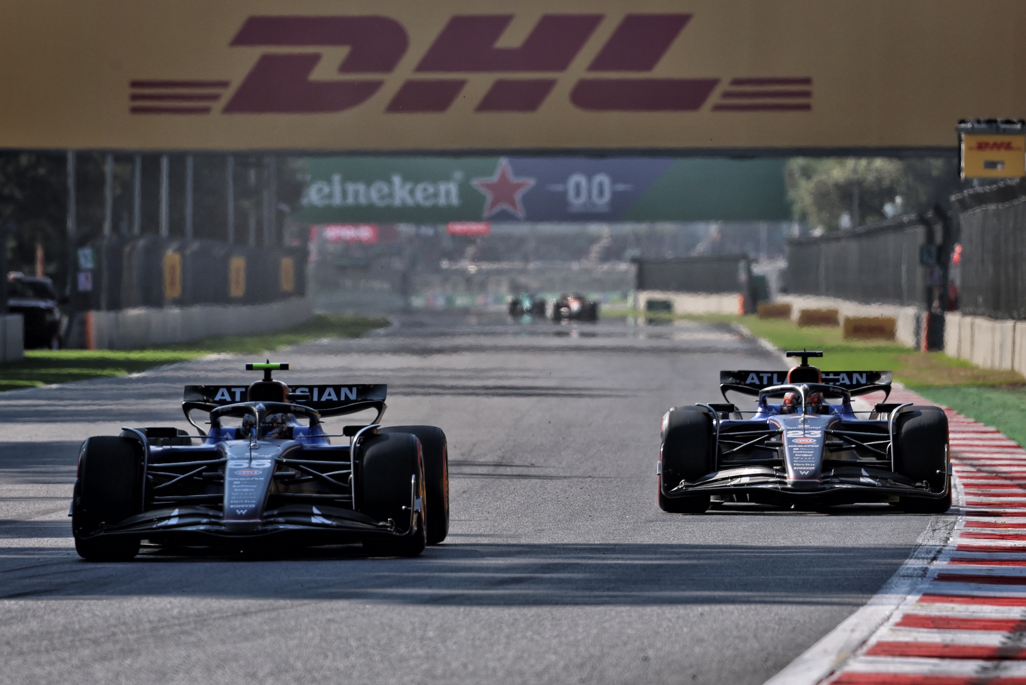 Carlos Sainz (ESP) Atlassian Williams Racing FW47 and Alexander Albon (THA) Atlassian Williams Racing FW47 battle for position.