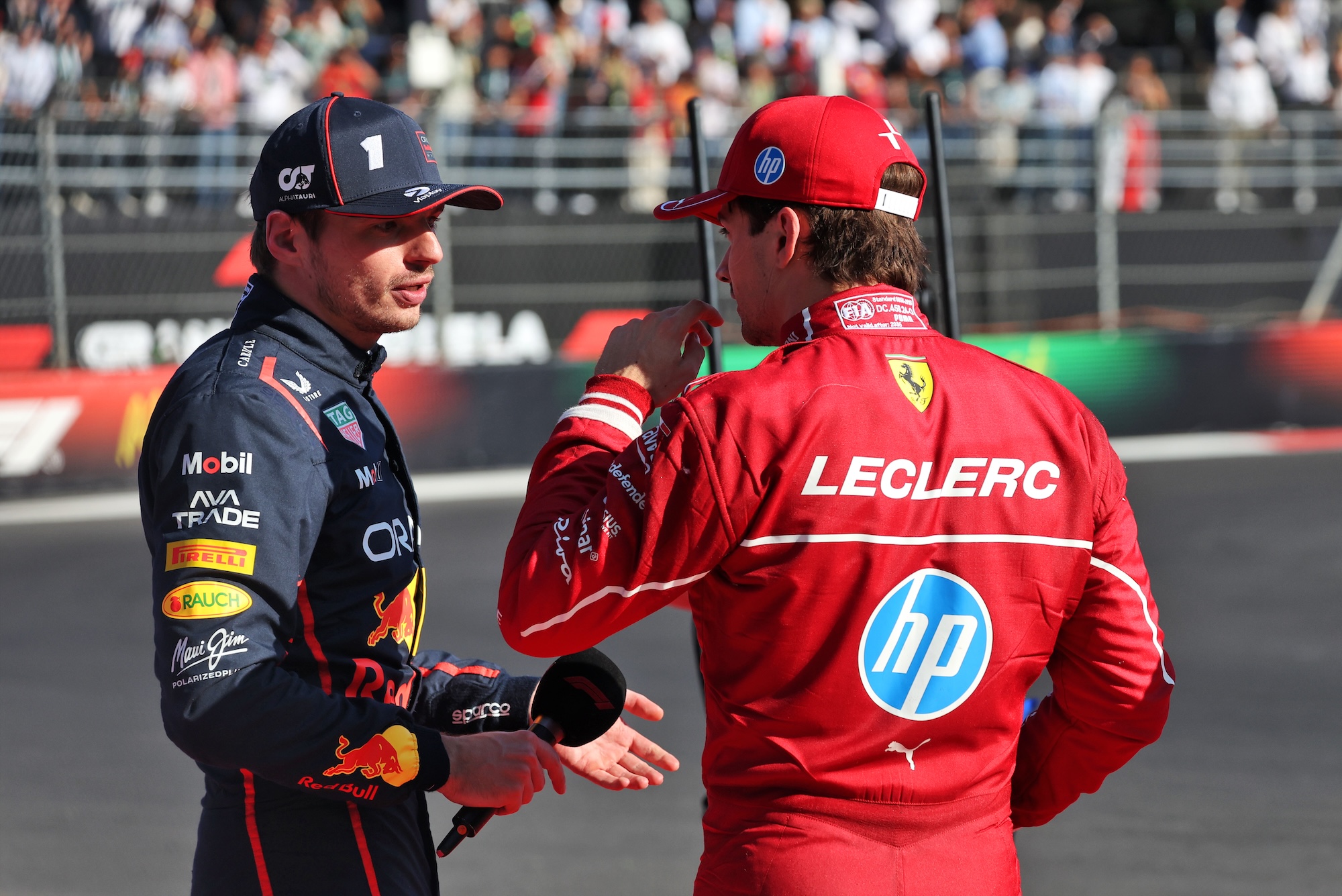 (L to R): Third placed Max Verstappen (NLD) Red Bull Racing in parc ferme with second placed Charles Leclerc (MON) Ferrari.