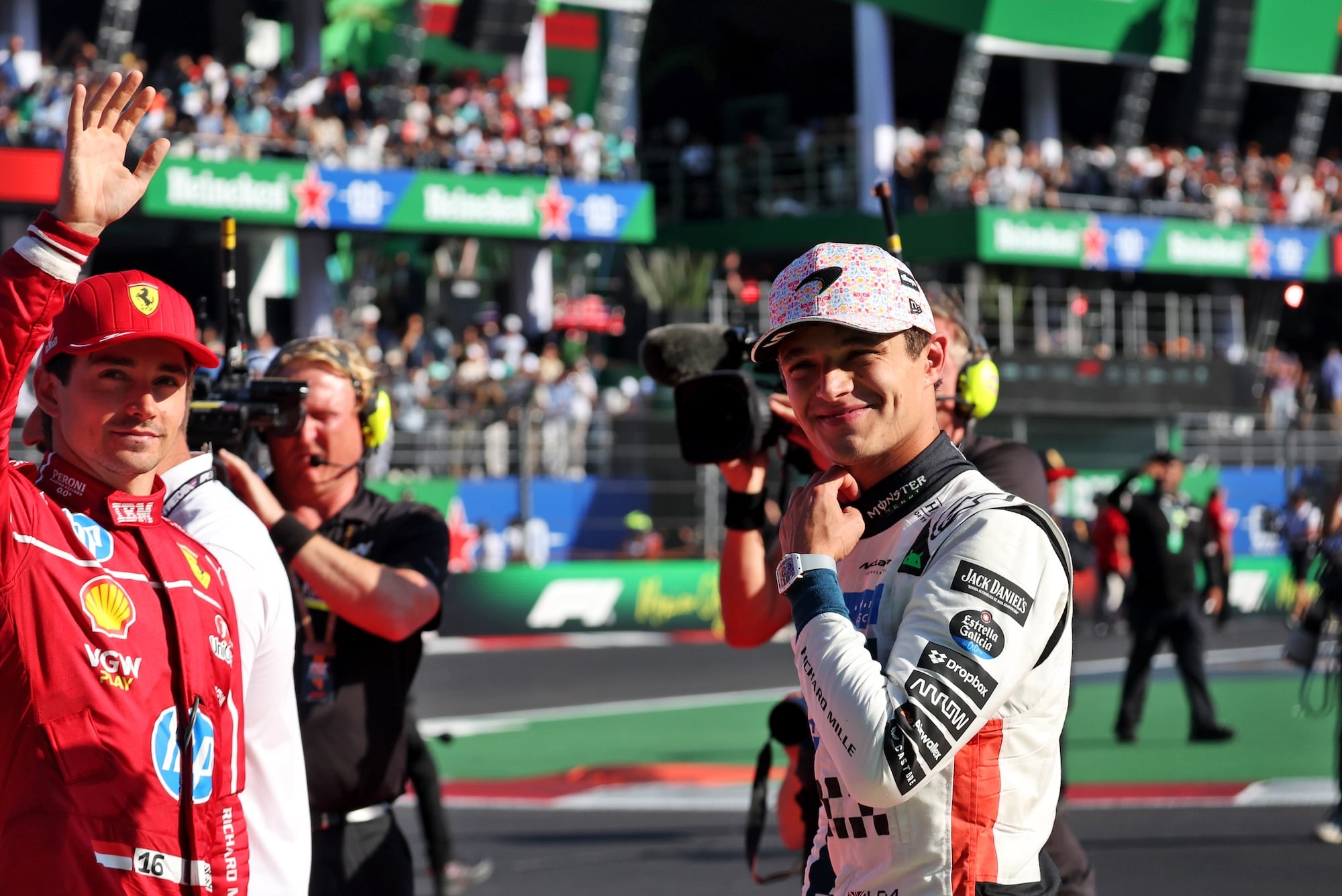 (L to R): Charles Leclerc (MON) Ferrari celebrates his second position in parc ferme with race winner Lando Norris (GBR) McLaren.