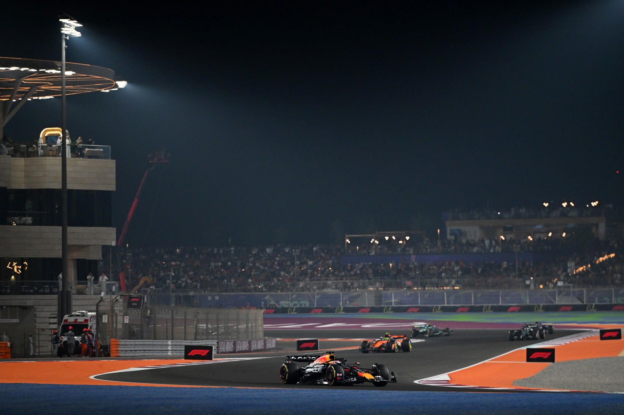 LUSAIL CITY, QATAR - NOVEMBER 30: Max Verstappen of the Netherlands driving the (1) Oracle Red Bull Racing RB21 leads Lando Norris of Great Britain driving the (4) McLaren MCL39 Mercedes on track during the F1 Grand Prix of Qatar at Lusail International Circuit on November 30, 2025 in Lusail City, Qatar. (Photo by Rudy Carezzevoli/Getty Images) // Getty Images / Red Bull Content Pool // SI202511300416 // Usage for editorial use only //