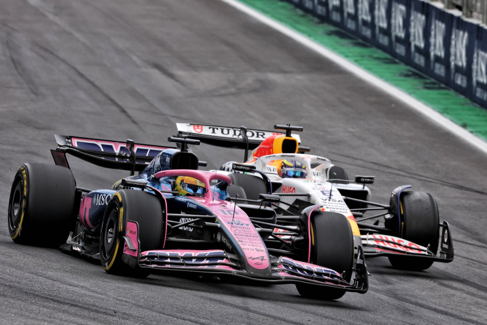 Pierre Gasly (FRA) Alpine F1 Team A525 and Isack Hadjar (FRA) Racing Bulls VCARB 02 battle for position.