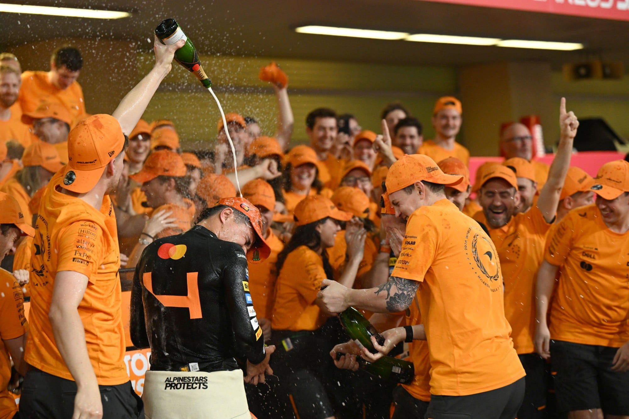 Lando Norris, McLaren F1 Team, 1st position, and the McLaren team celebrate after securing the Constructors Championship title