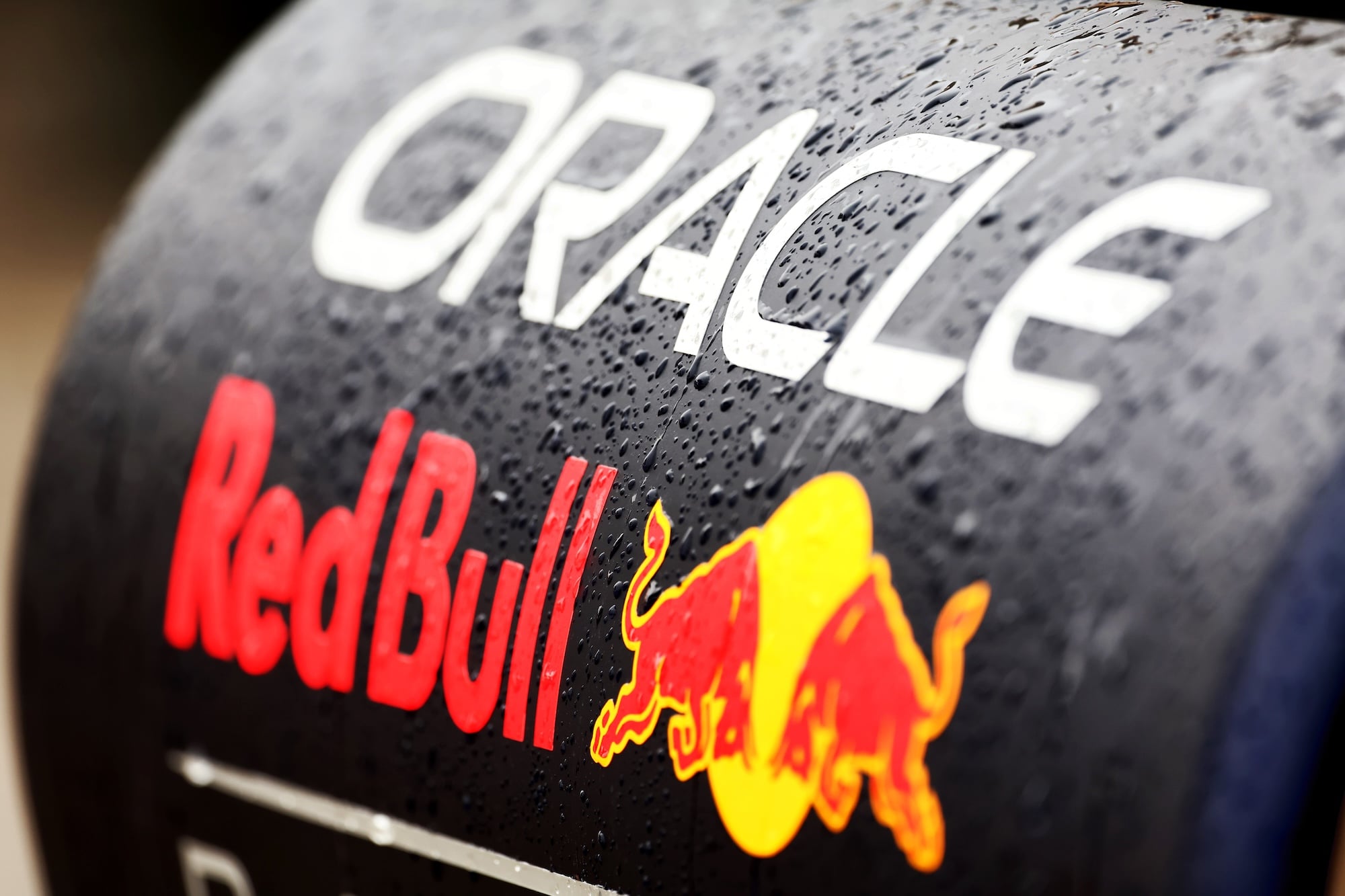 Red Bull Racing logo with rain drops.