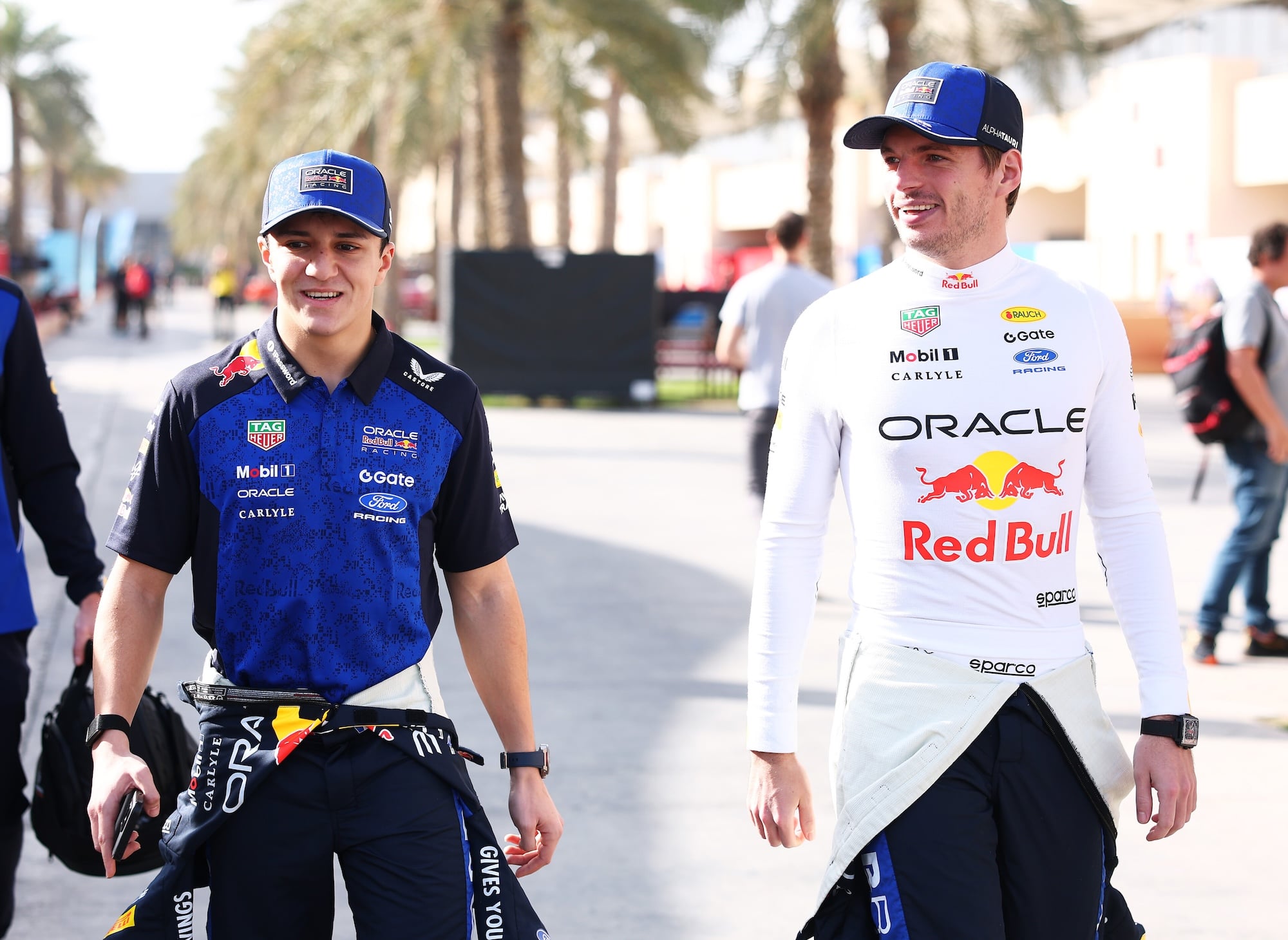 BAHRAIN, BAHRAIN - FEBRUARY 11: Isack Hadjar of France and Oracle Red Bull Racing and Max Verstappen of the Netherlands and Oracle Red Bull Racing walk in the Paddock during day one of F1 Testing at Bahrain International Circuit on February 11, 2026 in Bahrain, Bahrain. (Photo by Mark Thompson/Getty Images) // Getty Images / Red Bull Content Pool // SI202602114870 // Usage for editorial use only //