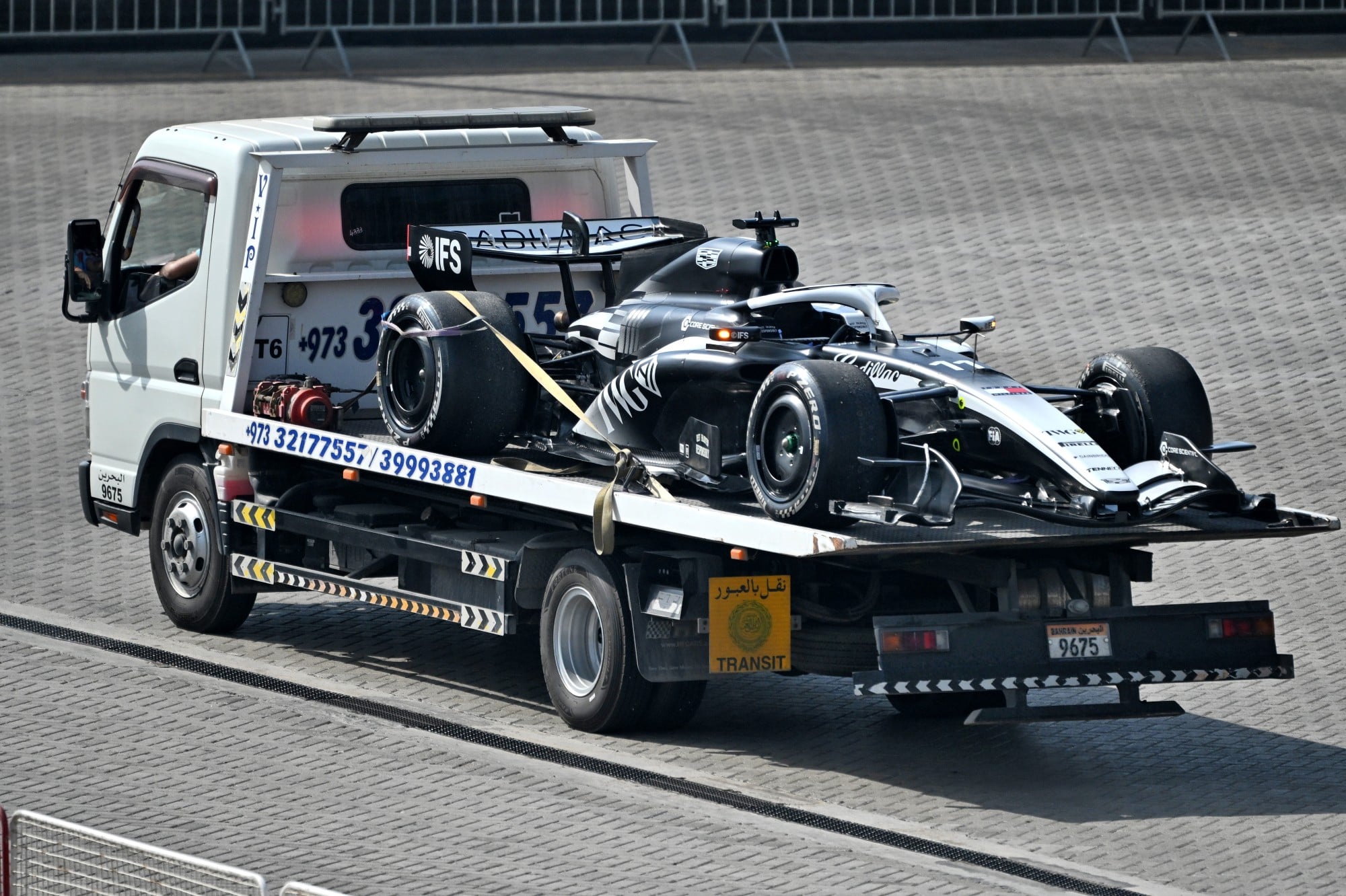 The Cadillac Formula 1 Team Car of Sergio Perez (MEX) is recovered back to the pits on the back of a truck.