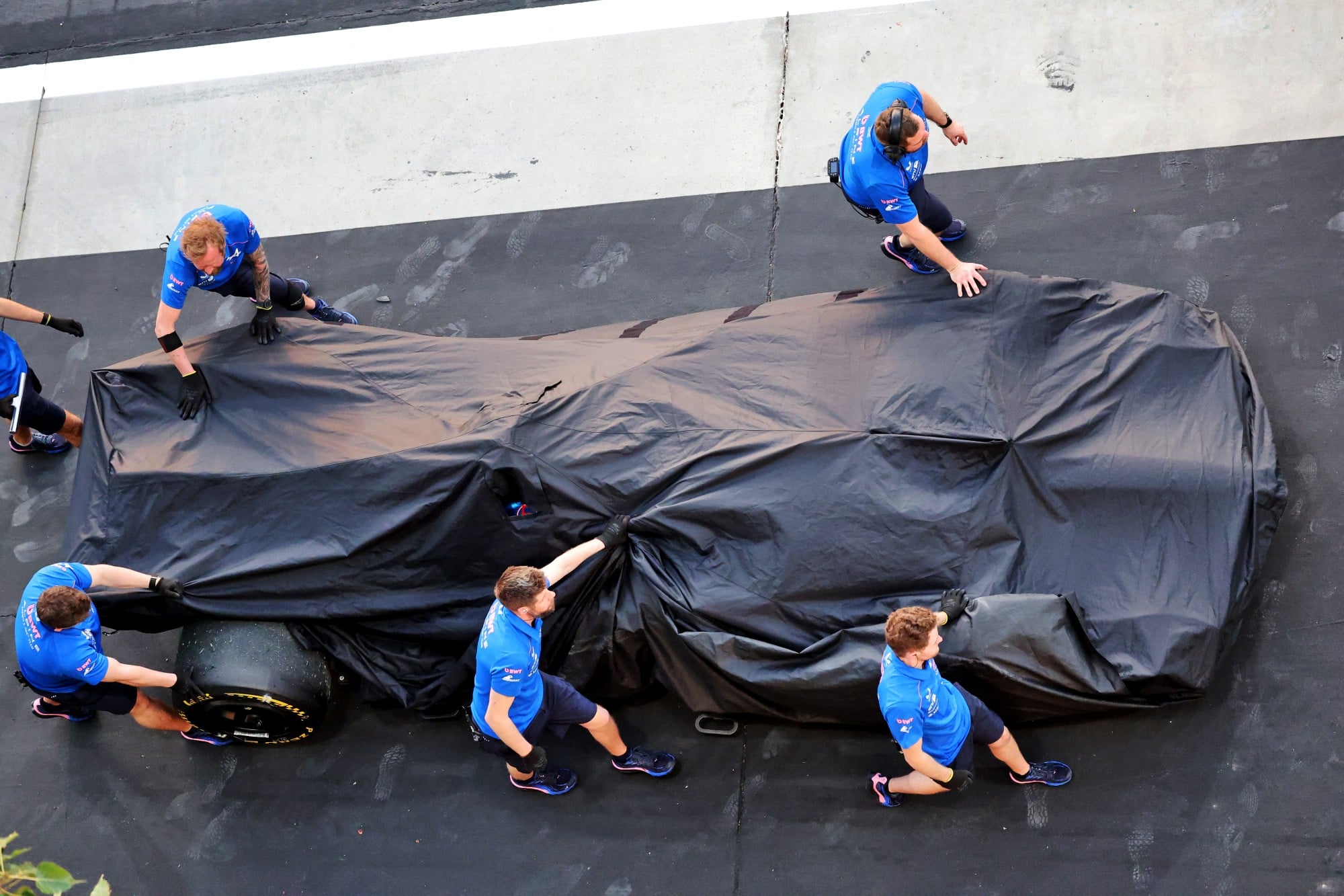 The Alpine F1 Team A526 of Pierre Gasly (FRA) Alpine F1 Team is recovered back to the pits by mechanics.