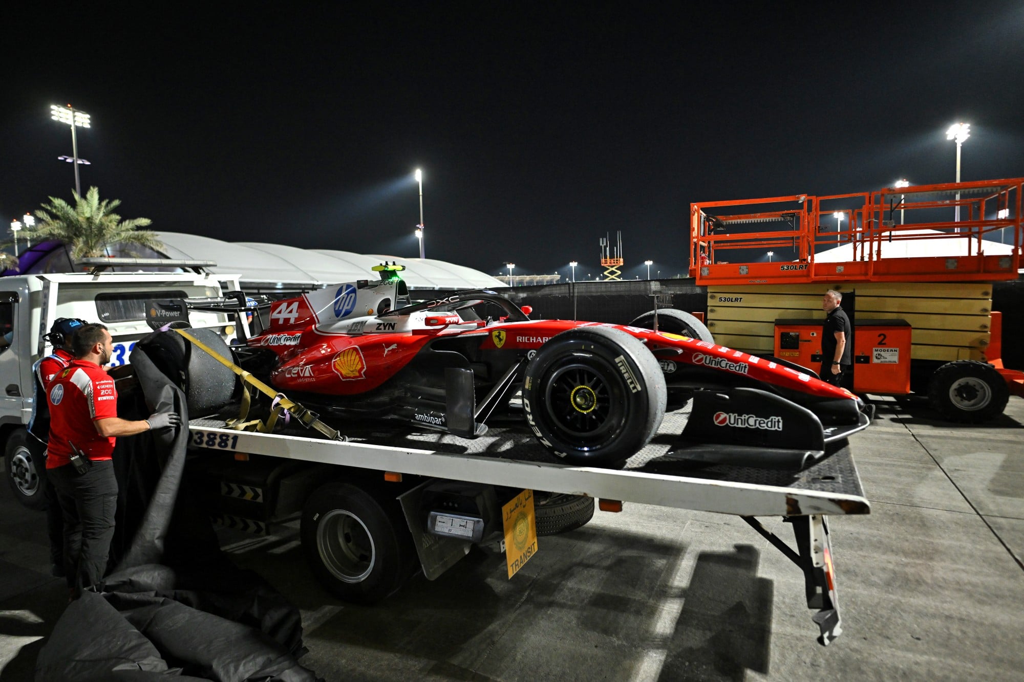 The Scuderia Ferrari SF-26 of Lewis Hamilton (GBR) is recovered back to the pits on the back of a truck.