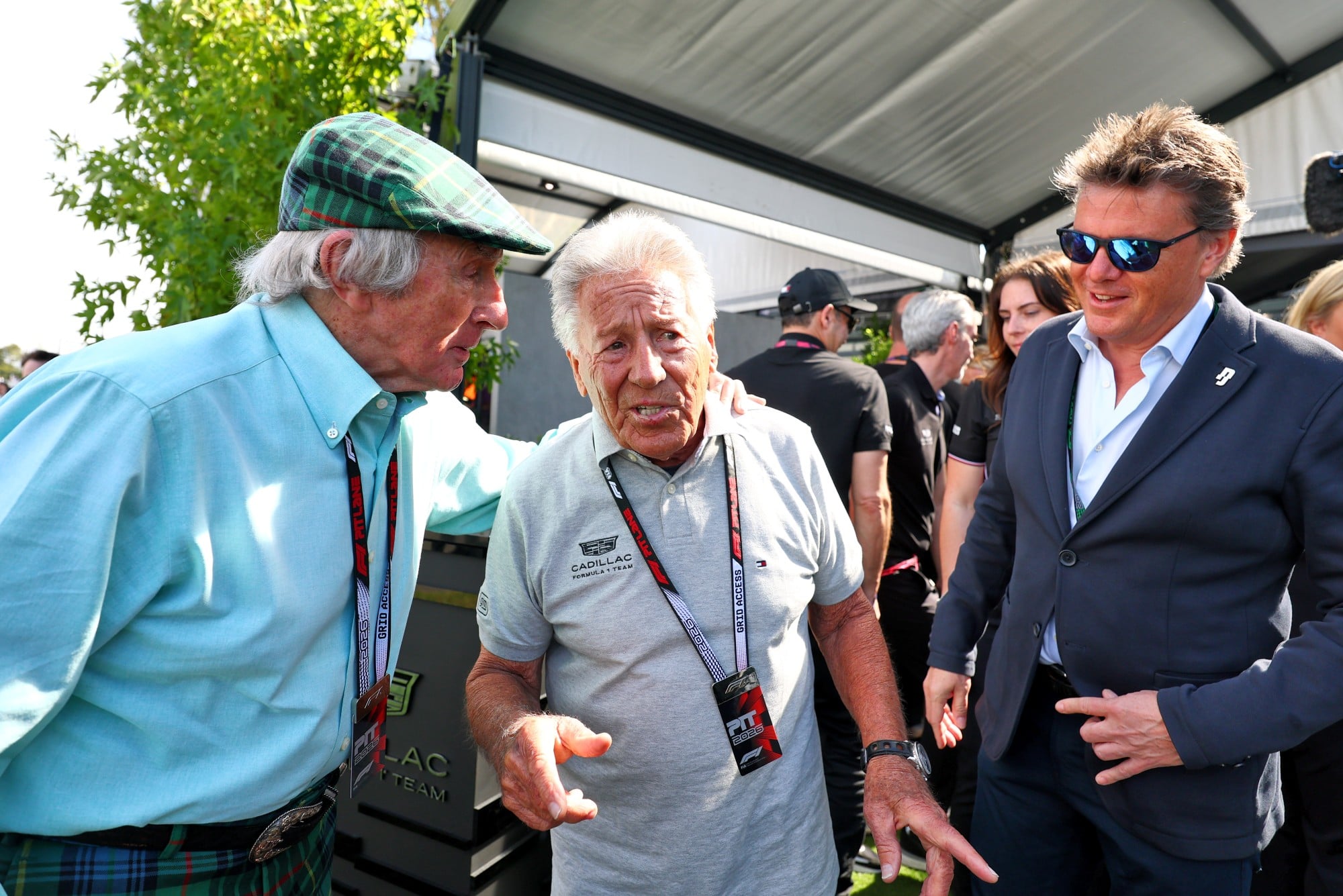 (L to R): Jackie Stewart (GBR) with Mario Andretti (USA) Cadillac Formula 1 Team Ambassador and Mark Stewart (GBR).