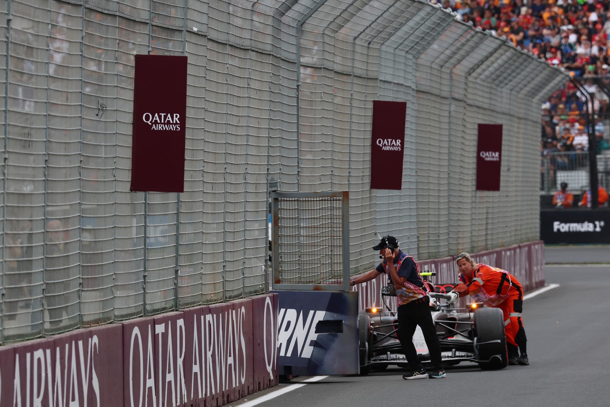 Gabriel Bortoleto (BRA) Audi F1 Team R26 stopped in the pit lane entrance.