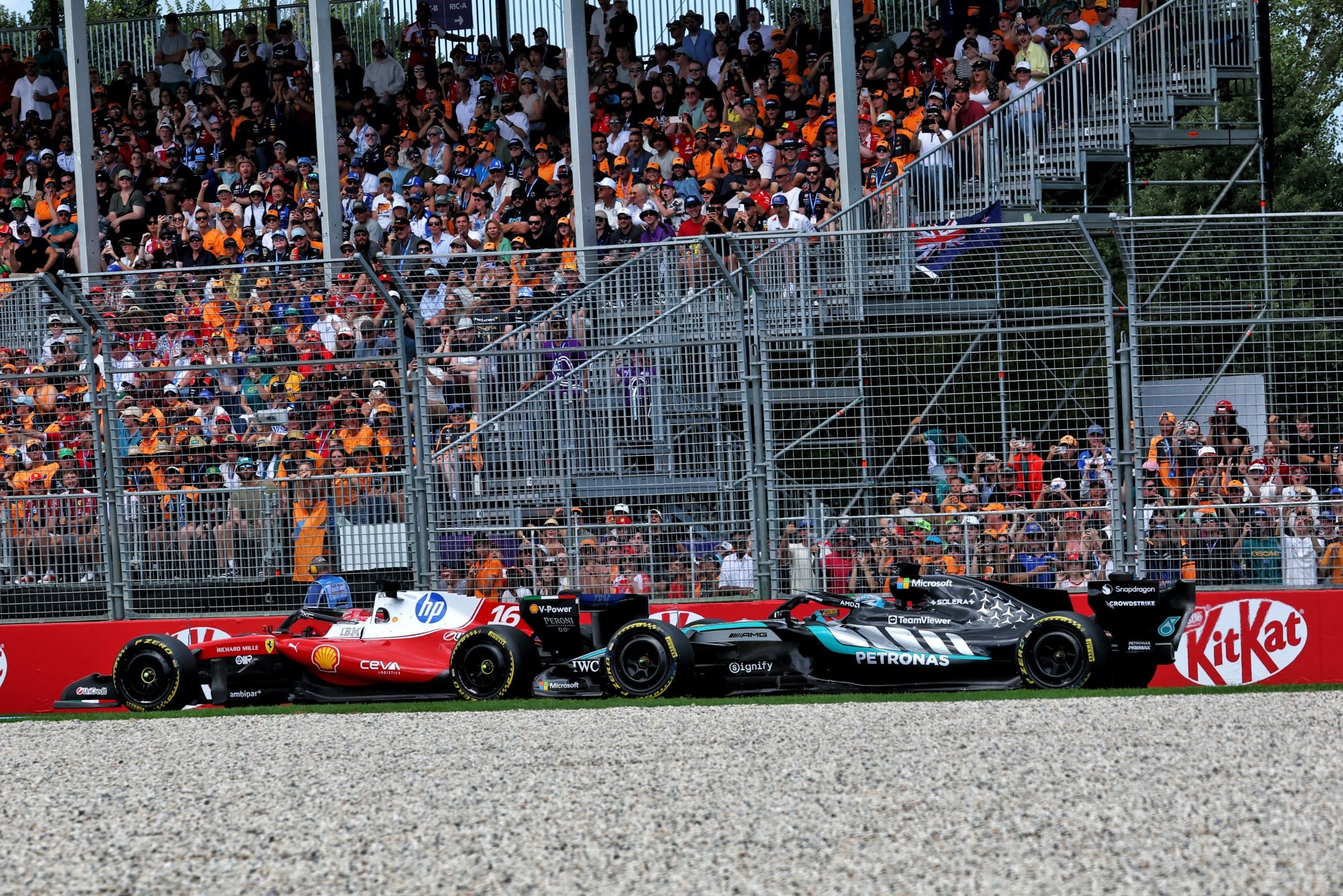 Charles Leclerc (MON) Scuderia Ferrari SF-26 battle for position with George Russell (GBR) Mercedes AMG Formula One Team W17.