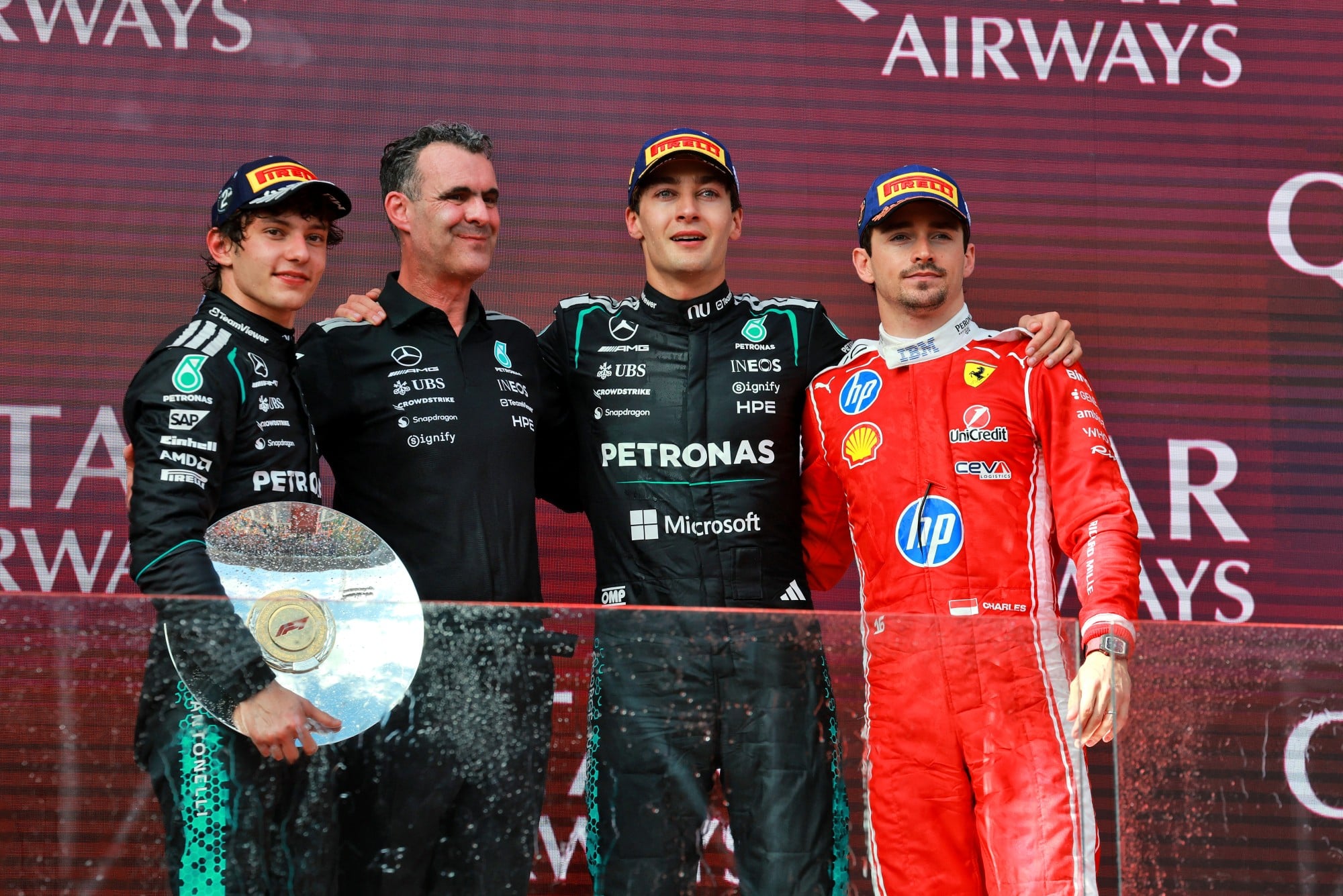 The podium (L to R): Andrea Kimi Antonelli (ITA) Mercedes AMG Formula One Team, second; Hywel Thomas (GBR) Mercedes AMG High Performance Powertrains Managing Director; George Russell (GBR) Mercedes AMG Formula One Team, race winner; Charles Leclerc (MON) Scuderia Ferrari, third.