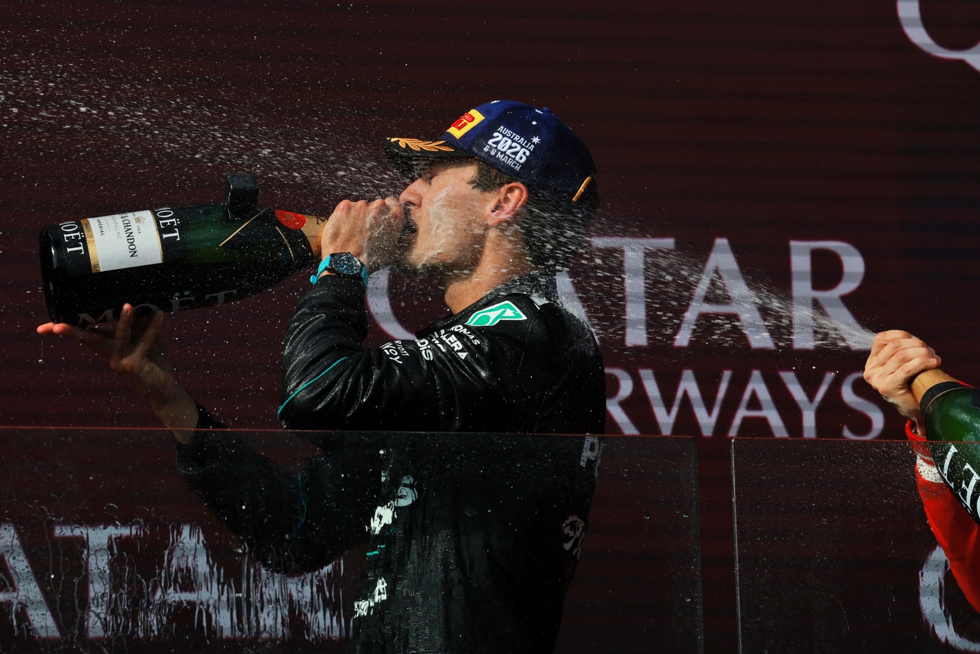 Race winner George Russell (GBR) Mercedes AMG Formula One Team celebrates on the podium.