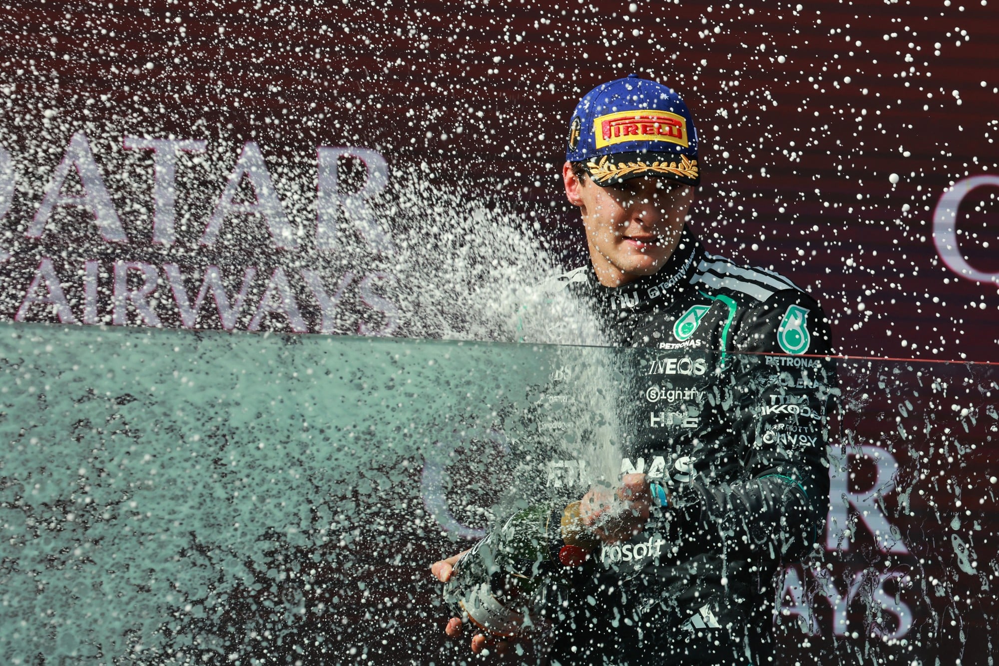 Race winner George Russell (GBR) Mercedes AMG Formula One Team celebrates on the podium.