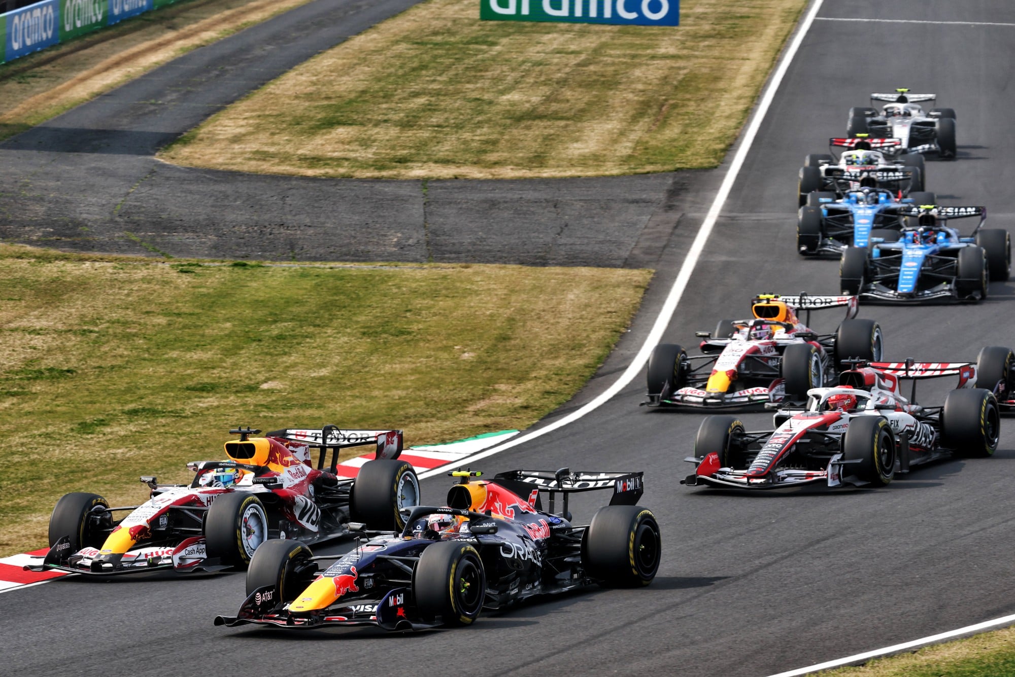 Isack Hadjar (FRA) Red Bull Racing RB22 and Arvid Lindblad (GBR) Racing Bulls Formula One Team VCARB 03 at the start of the race.