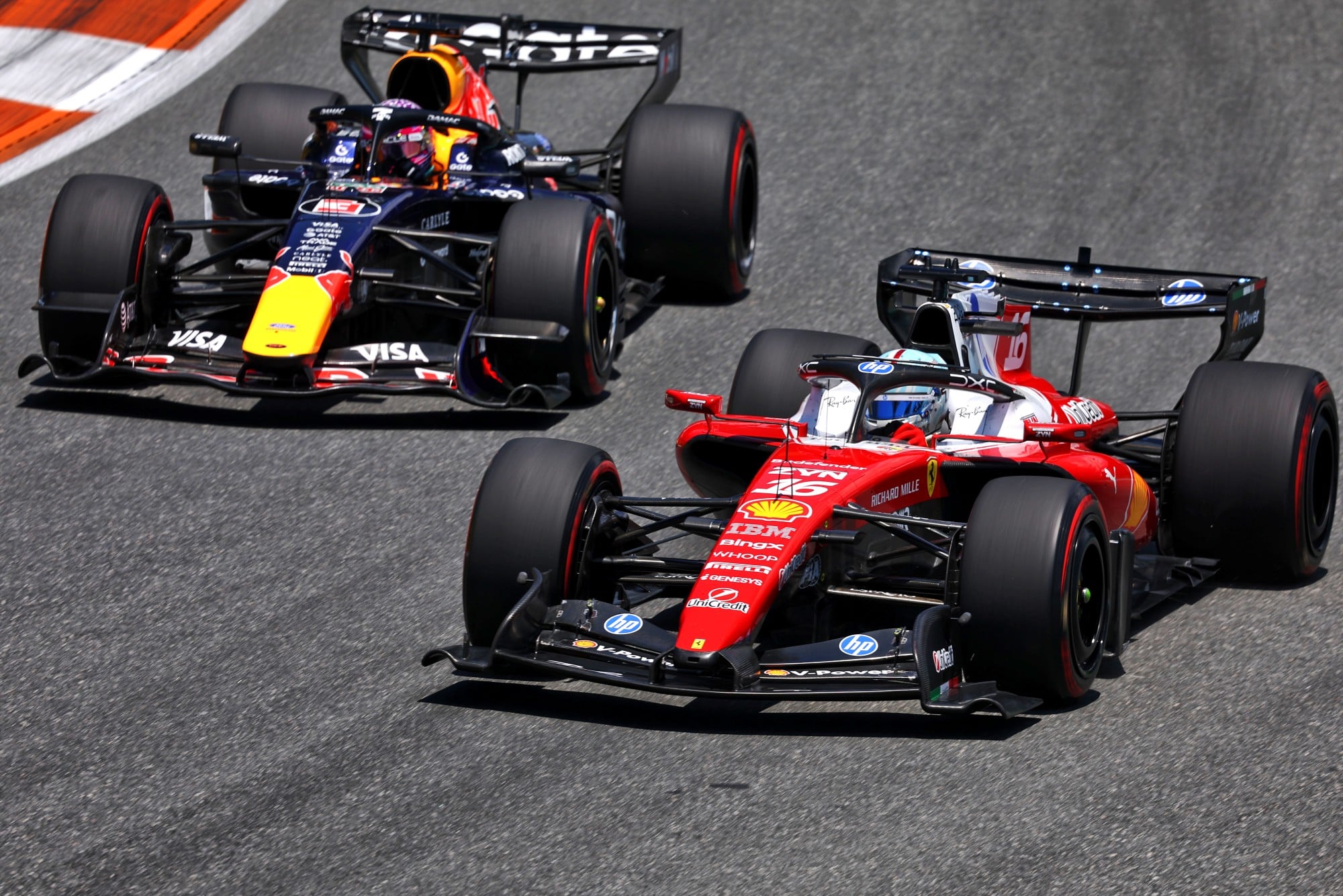 Charles Leclerc (MON) Scuderia Ferrari SF-26 and Max Verstappen (NLD) Red Bull Racing RB22.