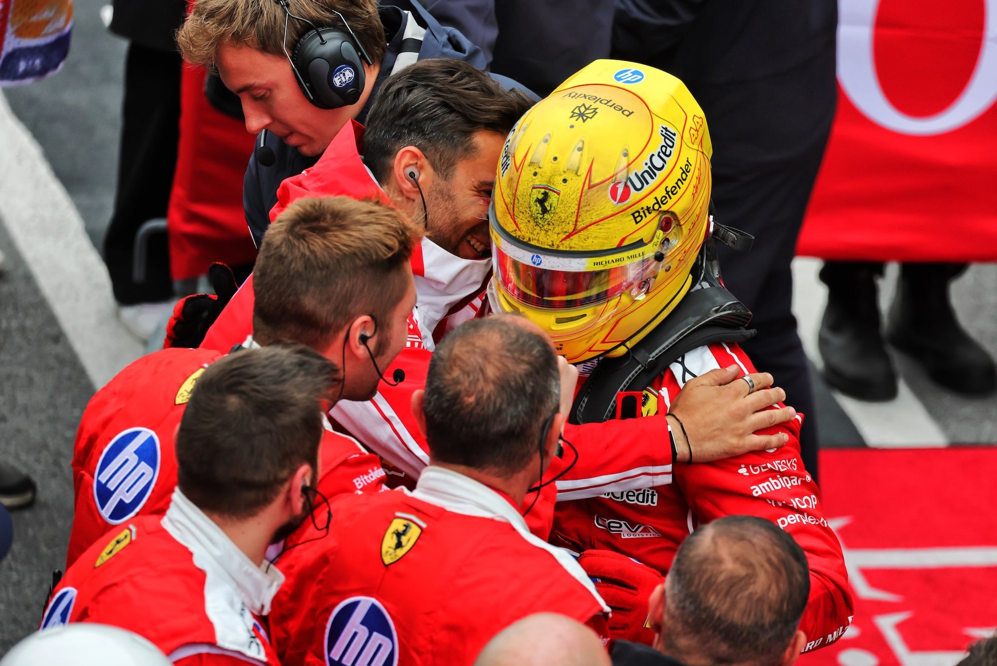 Lewis Hamilton (GBR) Scuderia Ferrari celebrates his second position with the team in parc ferme.