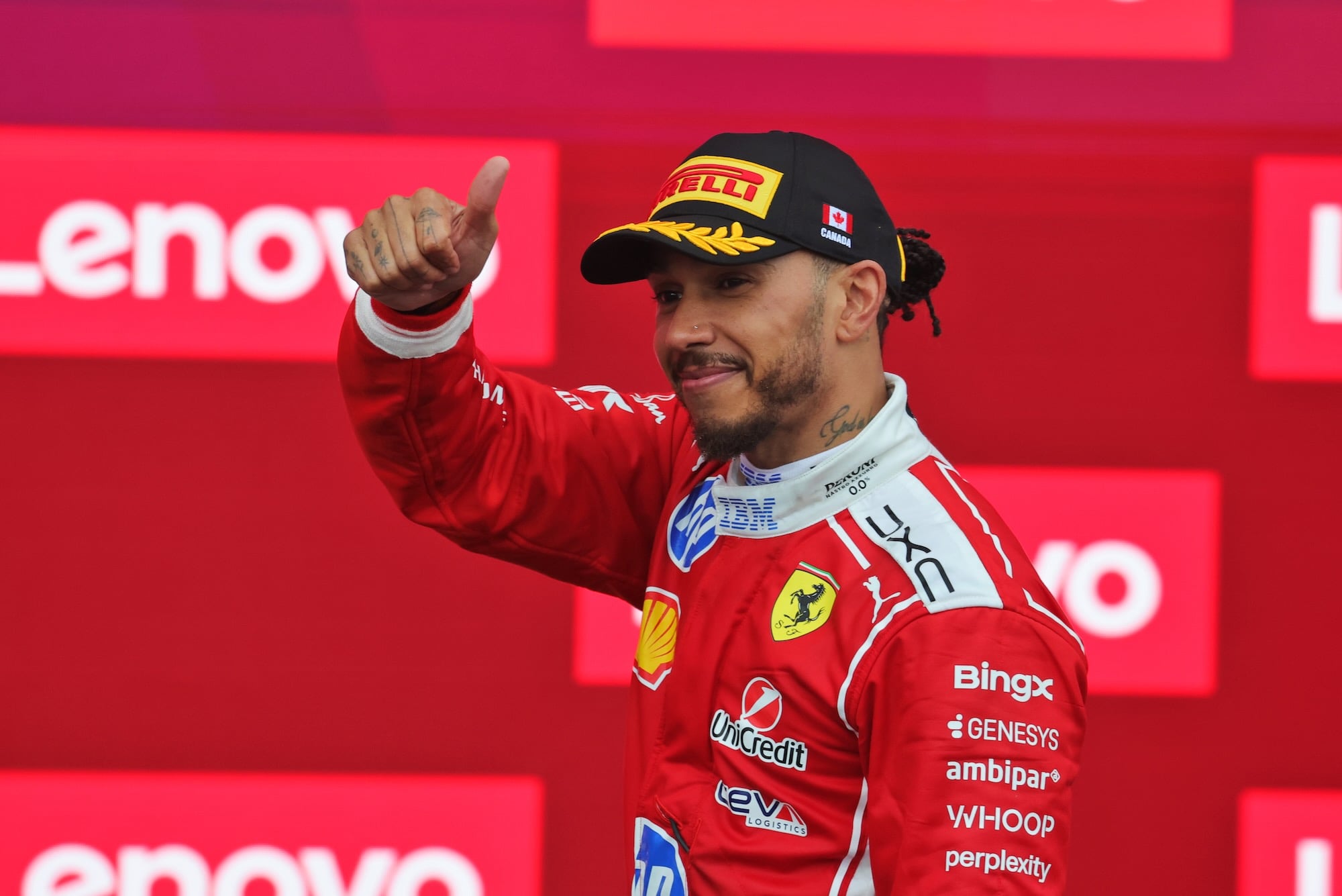 Lewis Hamilton (GBR) Scuderia Ferrari celebrates his second position on the podium.