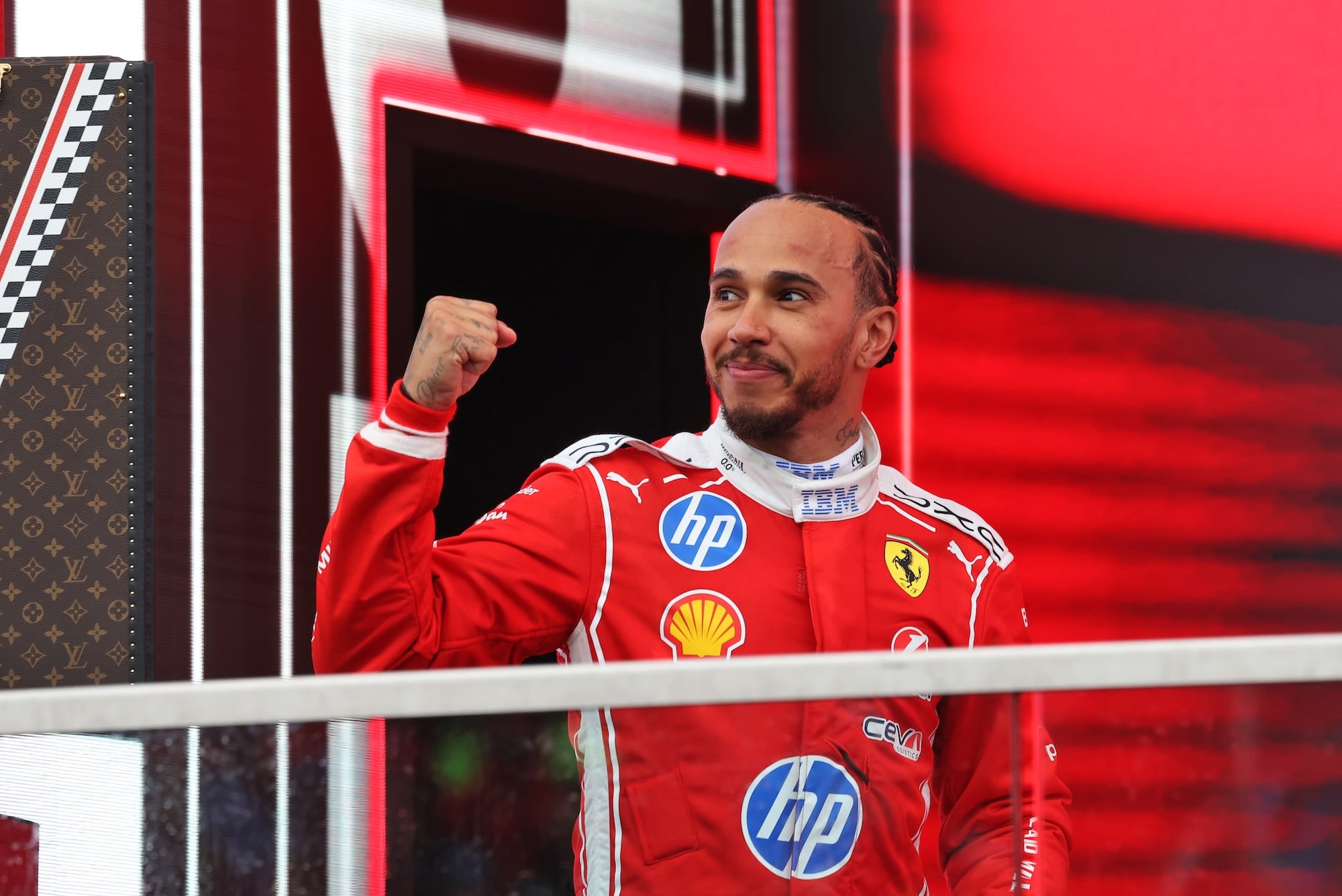 Lewis Hamilton (GBR) Scuderia Ferrari celebrates his second position on the podium.