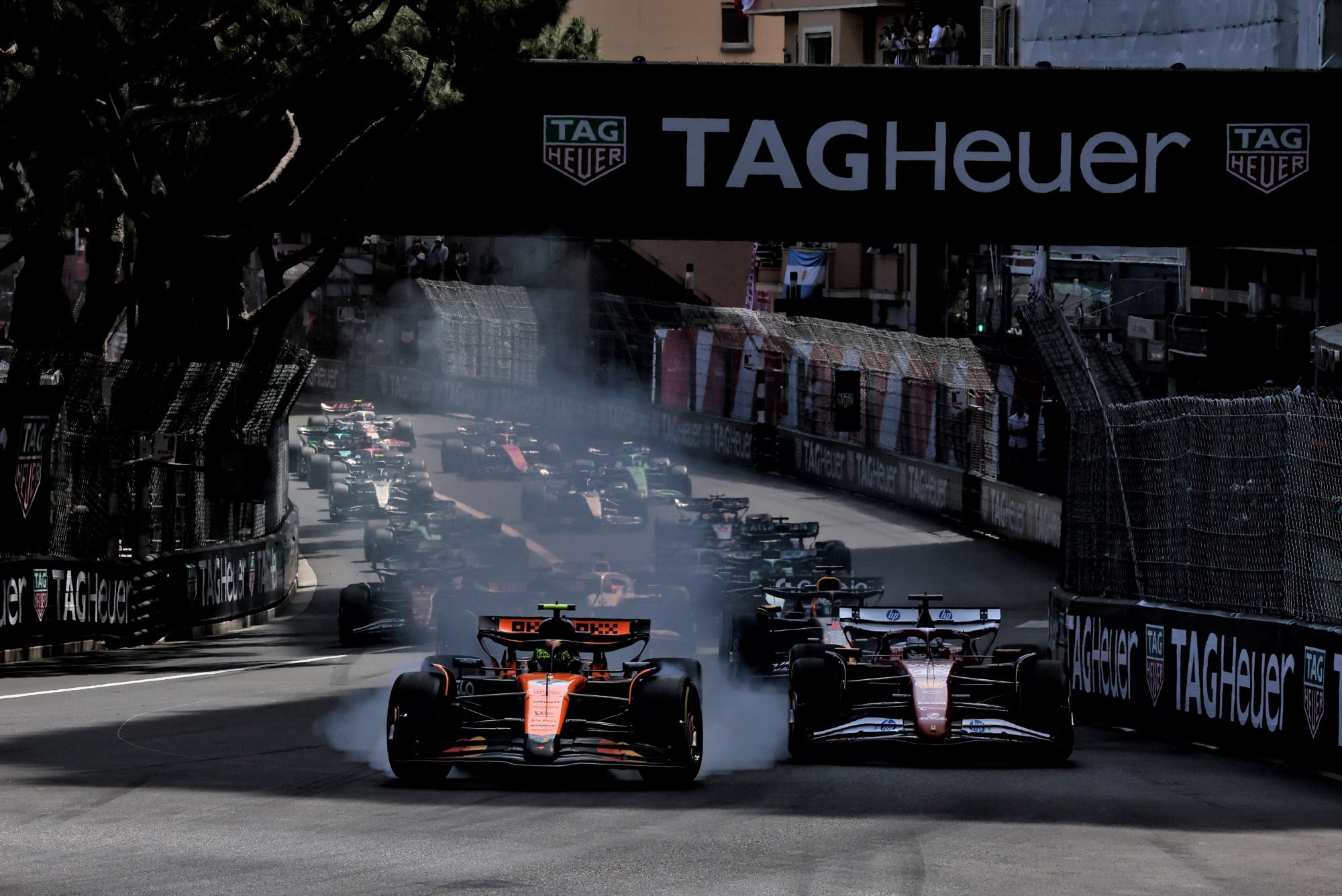 Lando Norris (GBR) McLaren MCL39 leads Charles Leclerc (MON) Ferrari SF-25 at the start of the race.