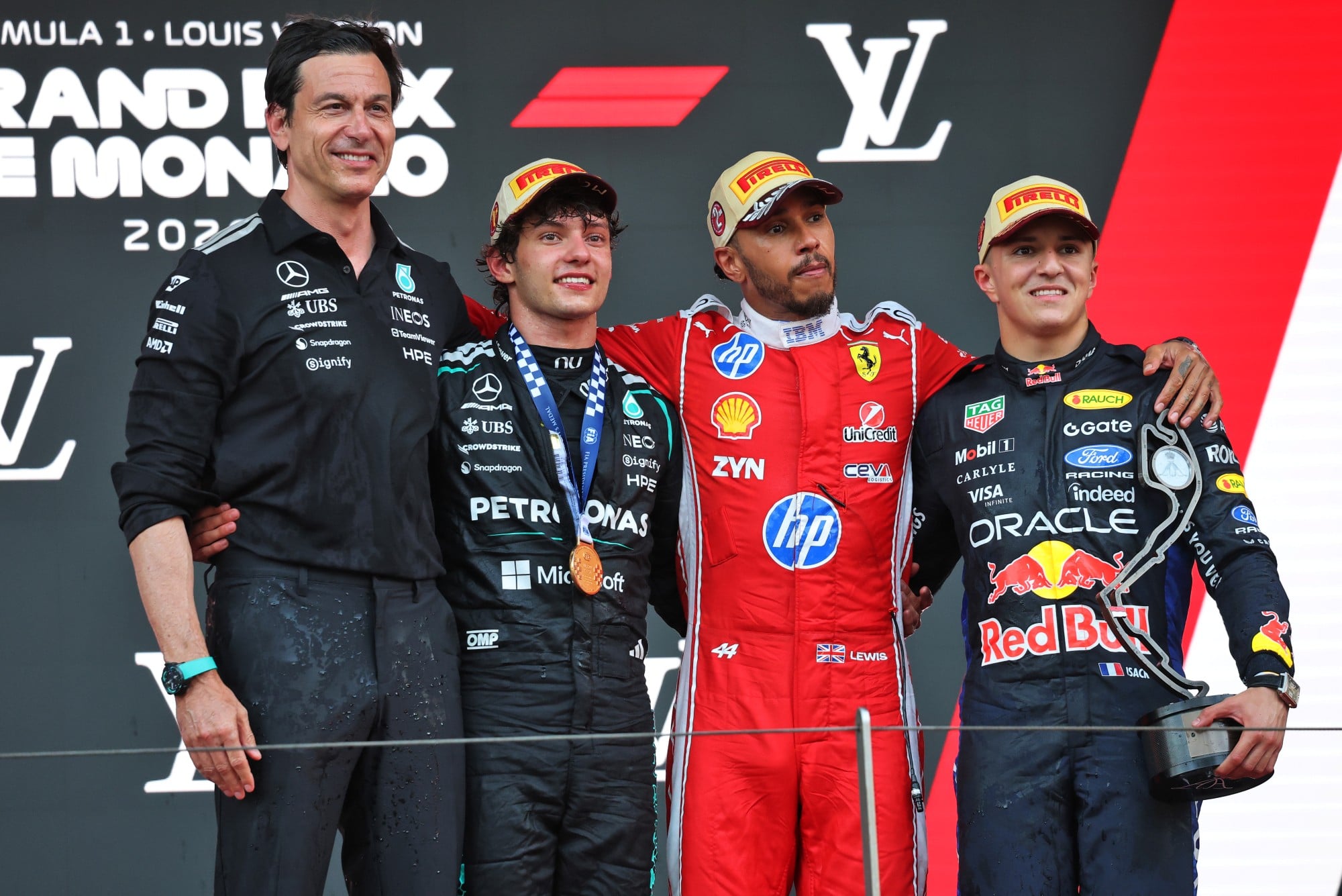 The podium (L to R): Toto Wolff (GER) Mercedes AMG Formula One Team Shareholder and Executive Director; Lewis Hamilton (GBR) Scuderia Ferrari, second; Andrea Kimi Antonelli (ITA) Mercedes AMG Formula One Team, race winner; Isack Hadjar (FRA) Red Bull Racing, third.