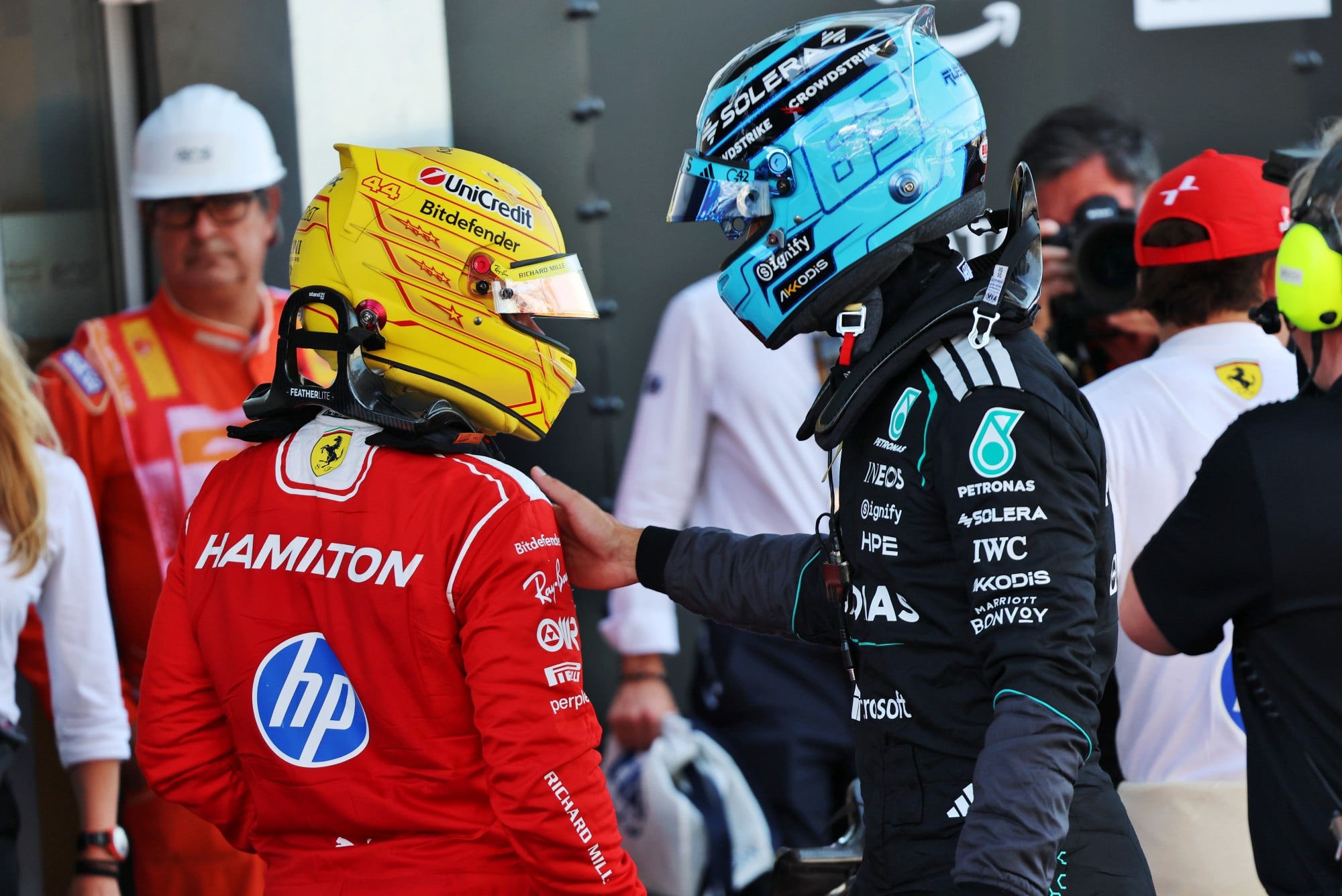 (L to R): Lewis Hamilton (GBR) Scuderia Ferrari in qualifying parc ferme with pole sitter George Russell (GBR) Mercedes AMG Formula One Team.