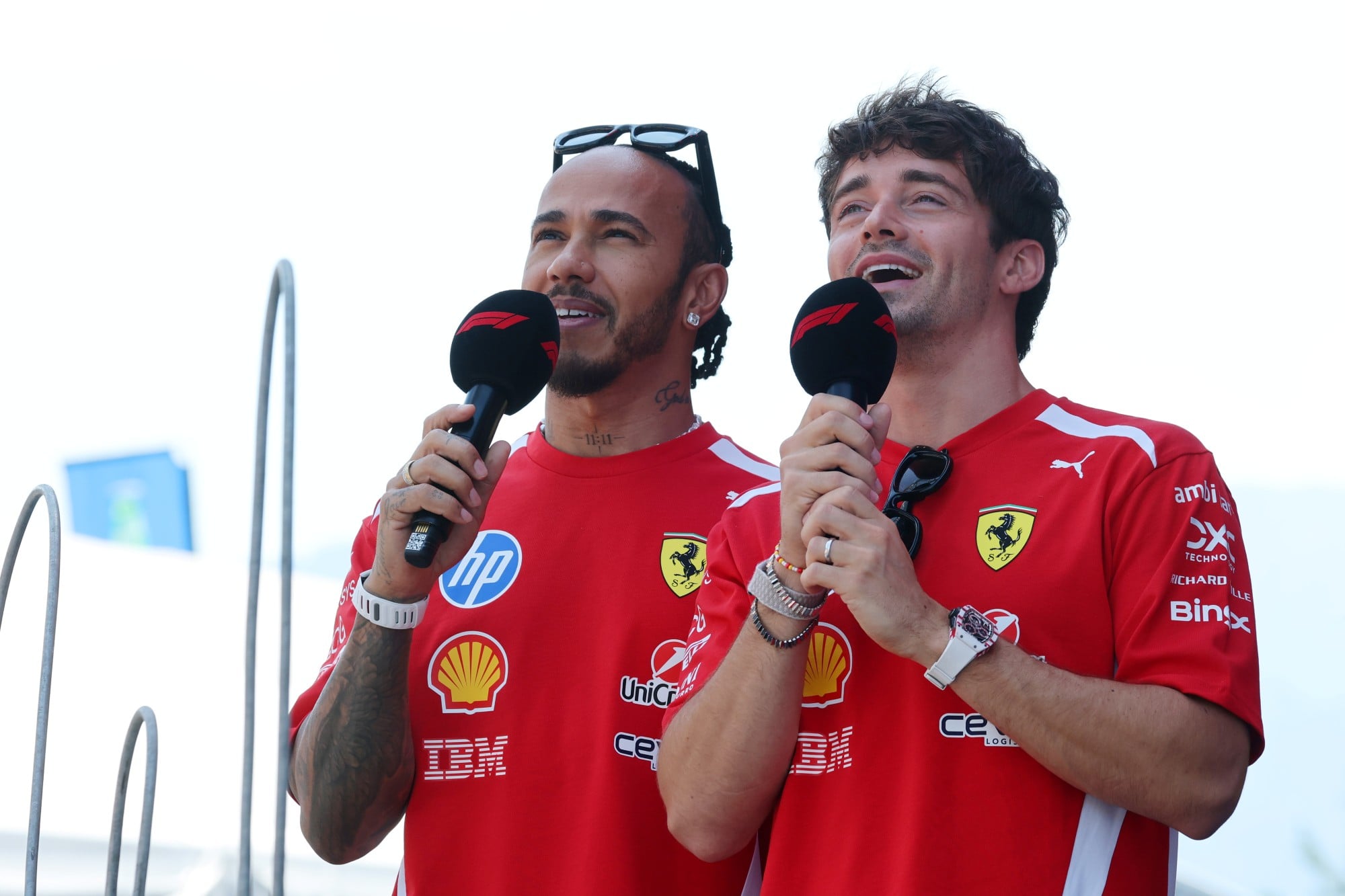Lewis Hamilton (GBR) Scuderia Ferrari and Charles Leclerc (MON) Scuderia Ferrari on the FanZone Stage.