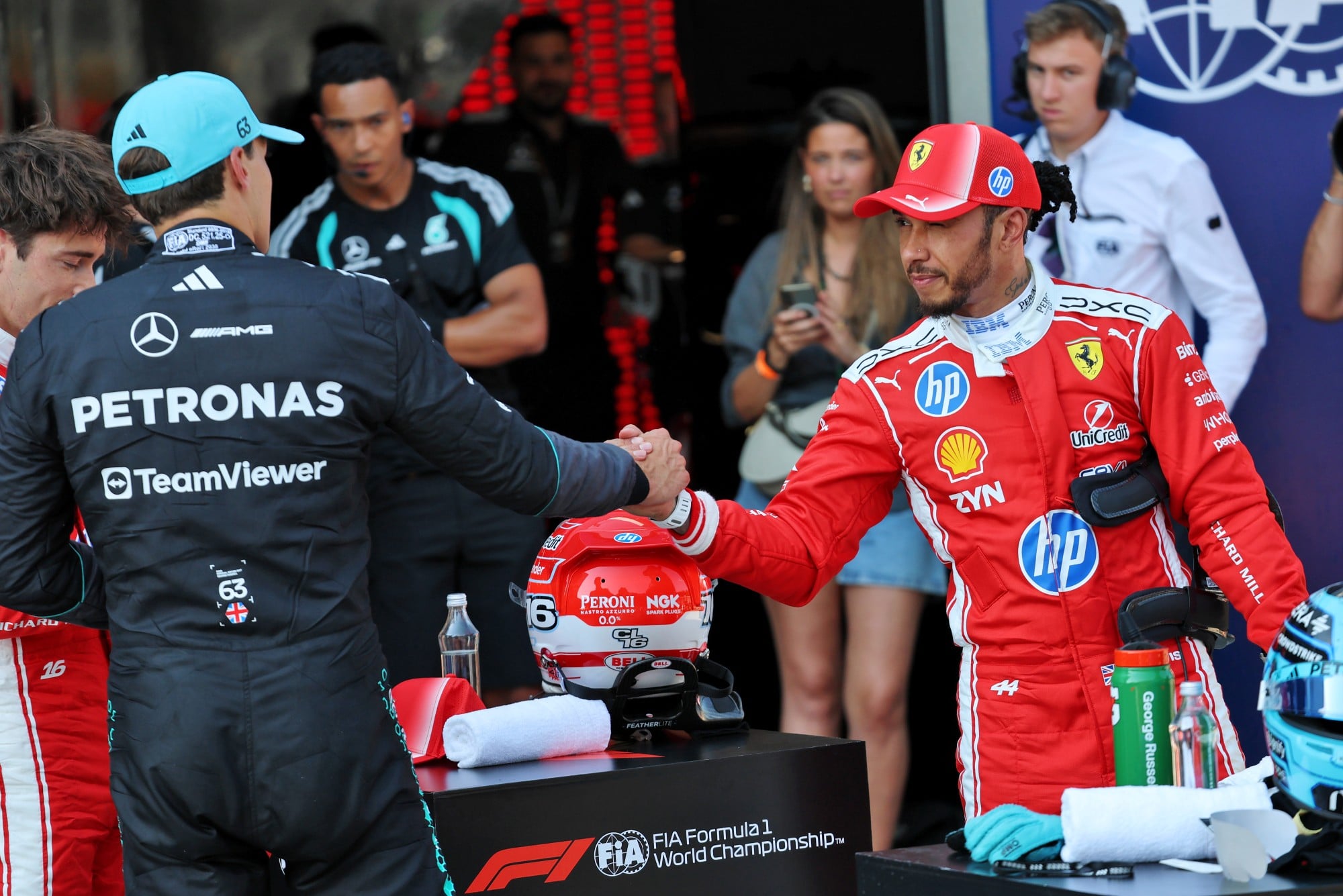 (L to R): Charles Leclerc (MON) Scuderia Ferrari with George Russell (GBR) Mercedes AMG Formula One Team and Lewis Hamilton (GBR) Scuderia Ferrari in qualifying parc ferme.