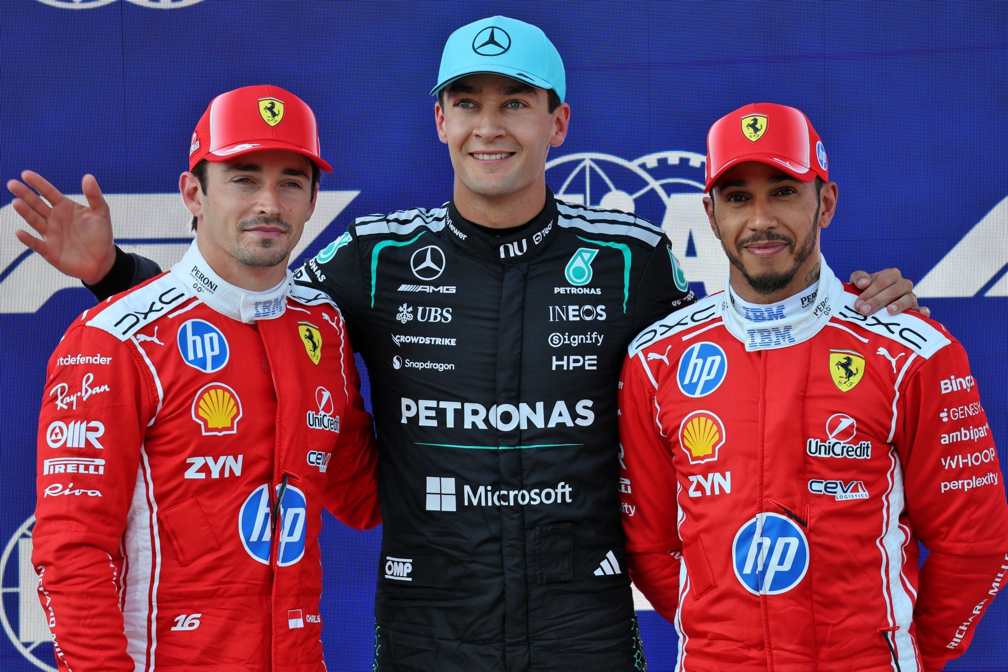 Topo three in qualifying parc ferme (L to R): Charles Leclerc (MON) Scuderia Ferrari, second; George Russell (GBR) Mercedes AMG Formula One Team, pole position; Lewis Hamilton (GBR) Scuderia Ferrari, third.