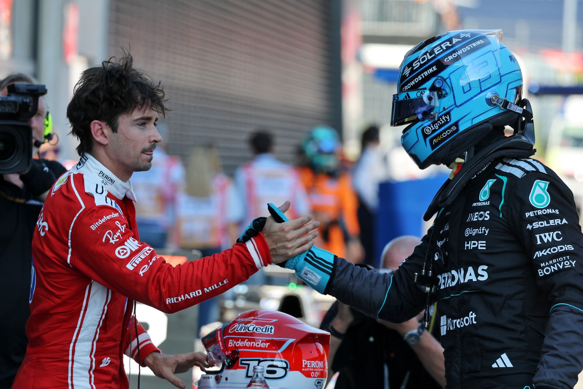 George Russell (GBR) Mercedes AMG Formula One Team celebrates pole position in qualifying parc ferme with second placed Charles Leclerc (MON) Scuderia Ferrari (Left).