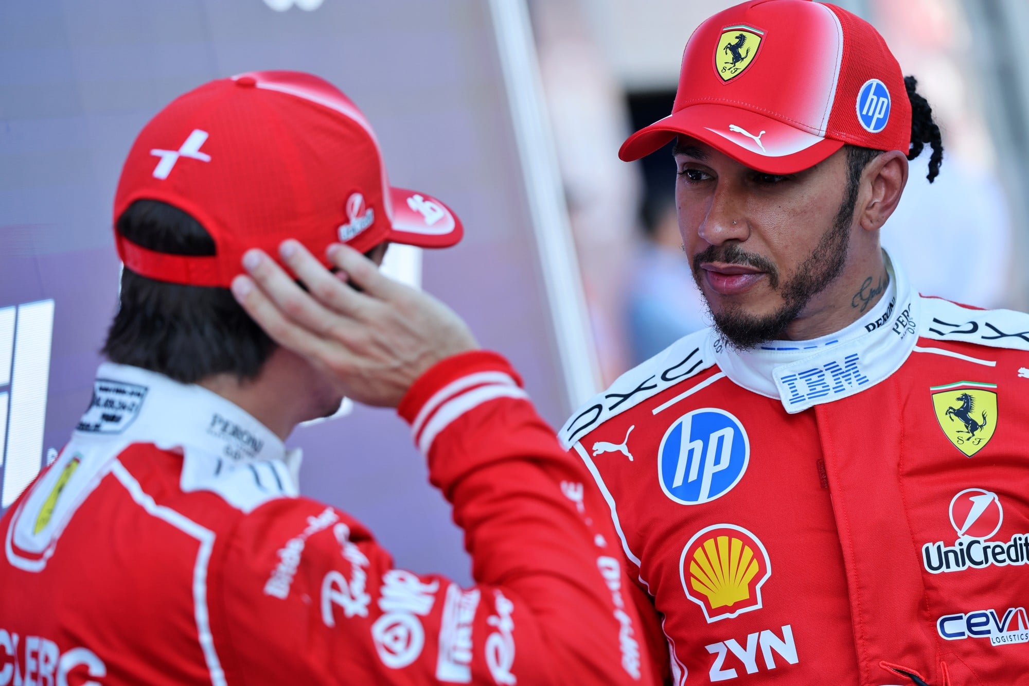 Lewis Hamilton (GBR) Scuderia Ferrari with team mate Charles Leclerc (MON) Scuderia Ferrari in qualifying parc ferme.