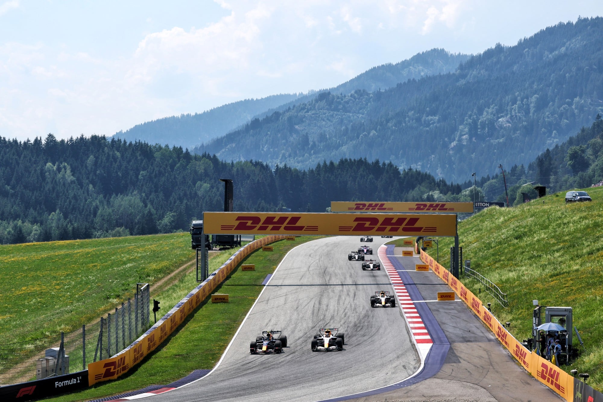 Isack Hadjar (FRA) Red Bull Racing RB22 and Liam Lawson (NZL) Racing Bulls Formula One Team VCARB 03 battle for position.