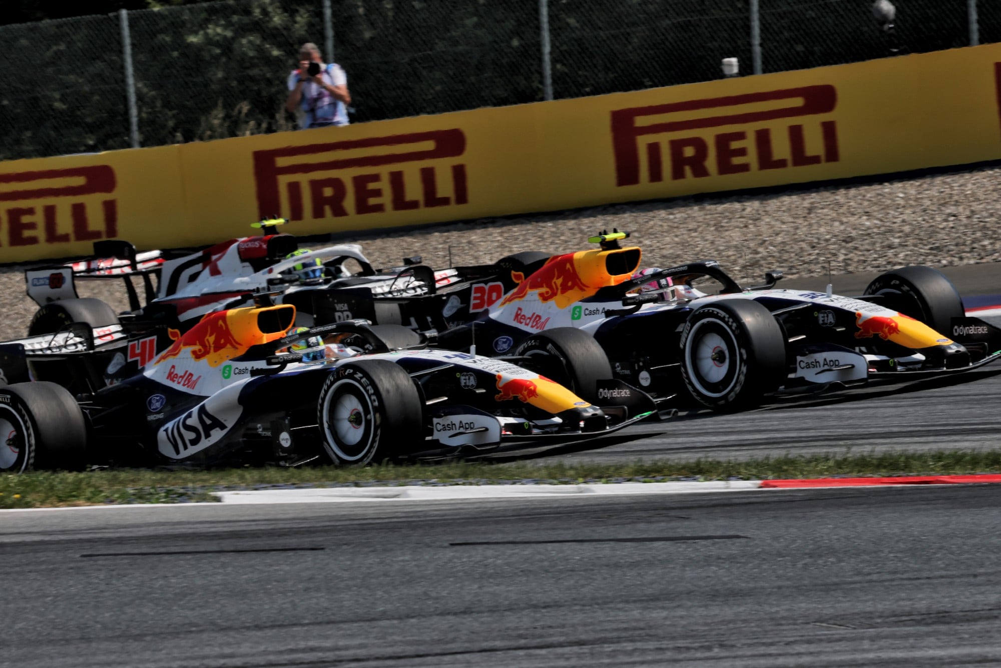 Arvid Lindblad (GBR) Racing Bulls Formula One Team VCARB 03 and Liam Lawson (NZL) Racing Bulls Formula One Team VCARB 03 battle for position.