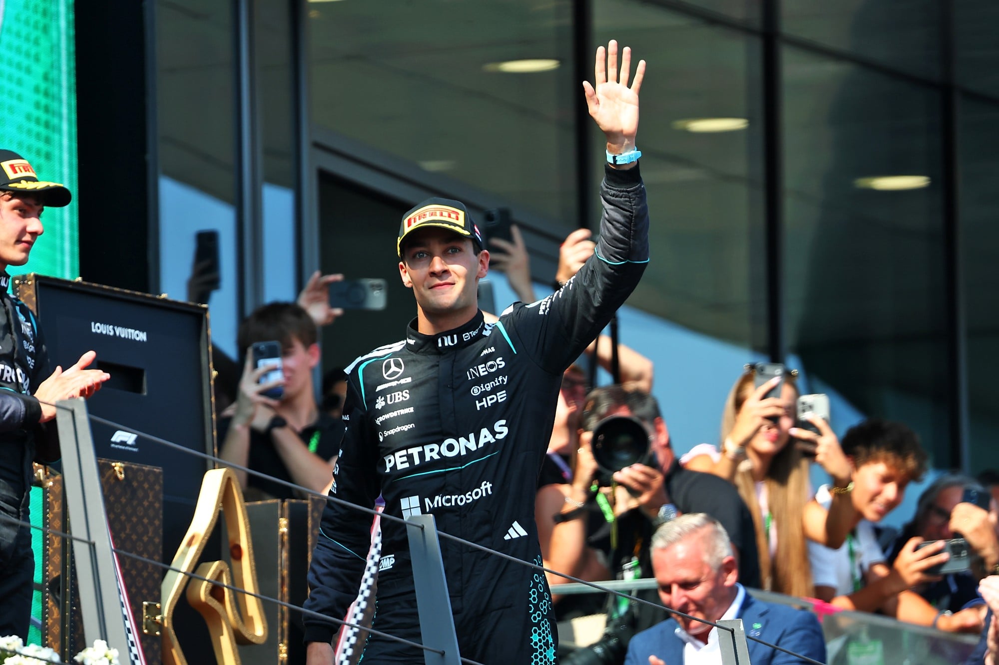 Race winner George Russell (GBR) Mercedes AMG Formula One Team celebrates on the podium.