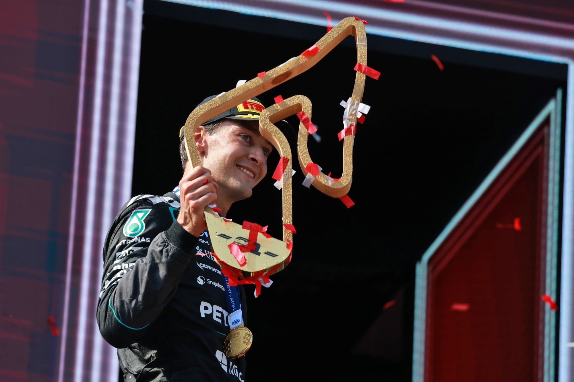 Race winner George Russell (GBR) Mercedes AMG Formula One Team celebrates on the podium.