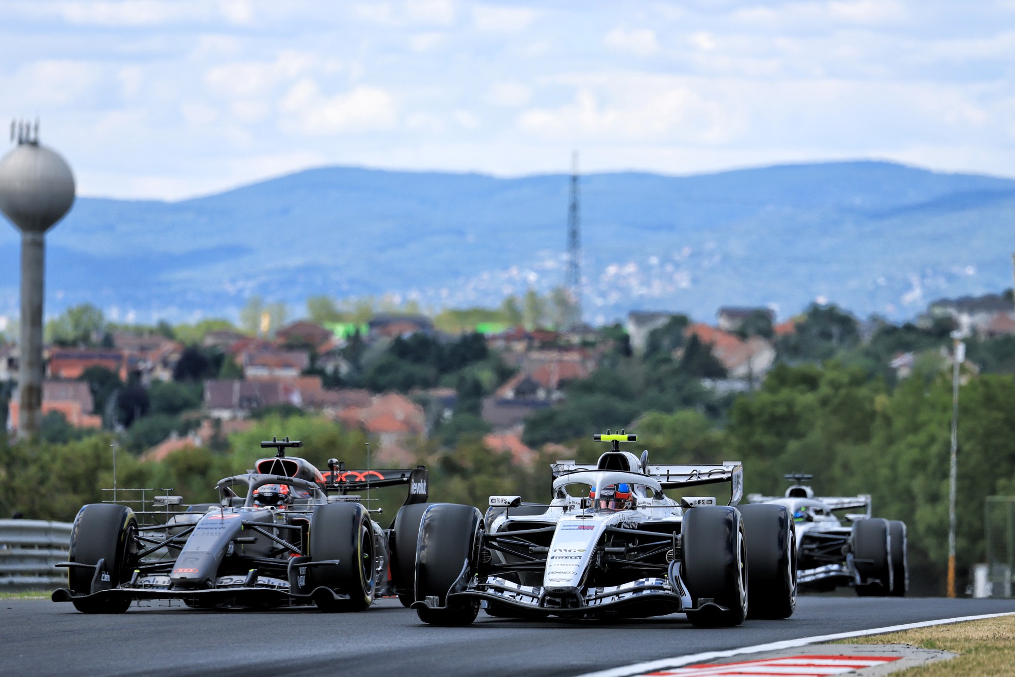 Colton Herta (USA) Cadillac Formula 1 Team MAC-26 Test Driver and Nico Hulkenberg (GER) Audi F1 Team R26.