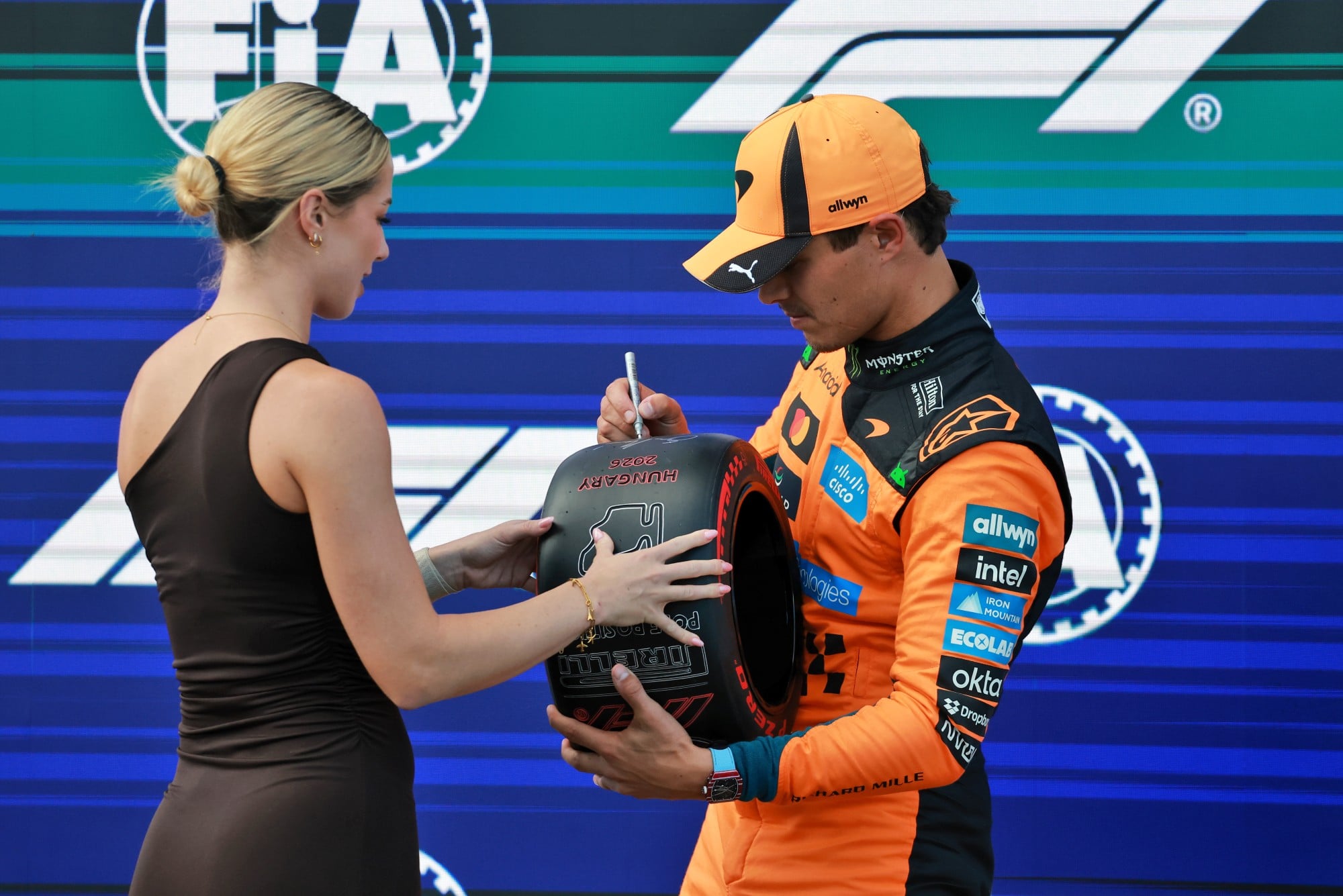 (L to R): Michelle Gulyas (HUN) Modern Pentathlete presents the Pirelli Pole Position Award to Lando Norris (GBR) McLaren F1 Team in qualifying parc ferme.
