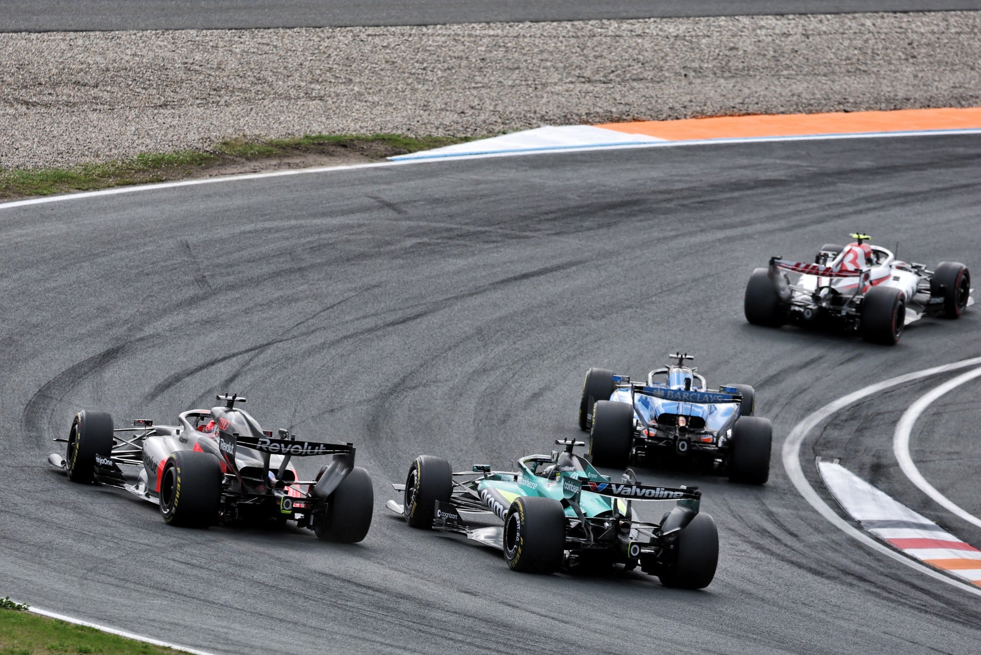 Lance Stroll (CDN) Aston Martin F1 Team AMR26 and Nico Hulkenberg (GER) Audi F1 Team R26 battle for position.