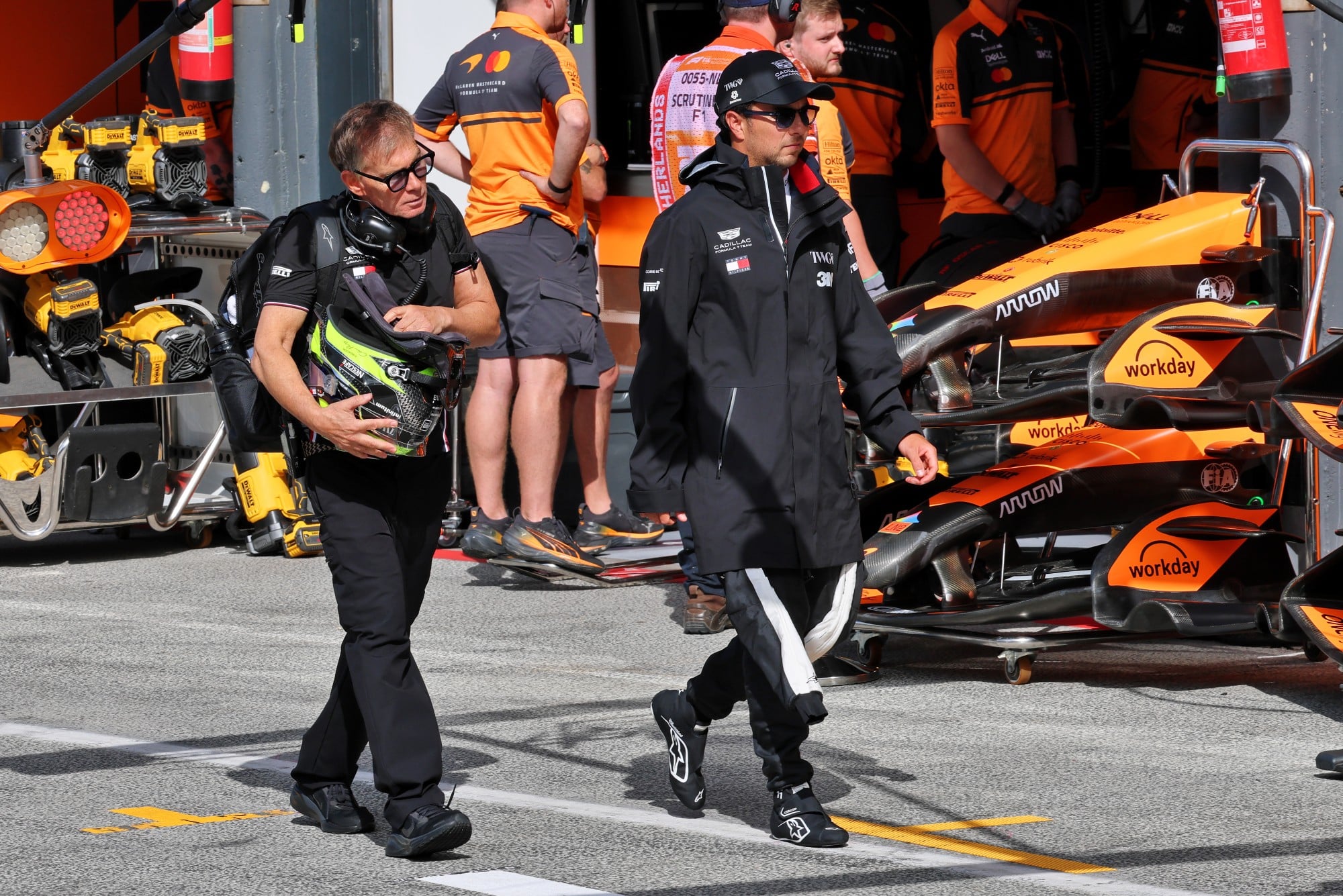(L to R): Xavi Martos (ESP) Cadillac Formula 1 Team Physio with Sergio Perez (MEX) Cadillac Formula 1 Team.