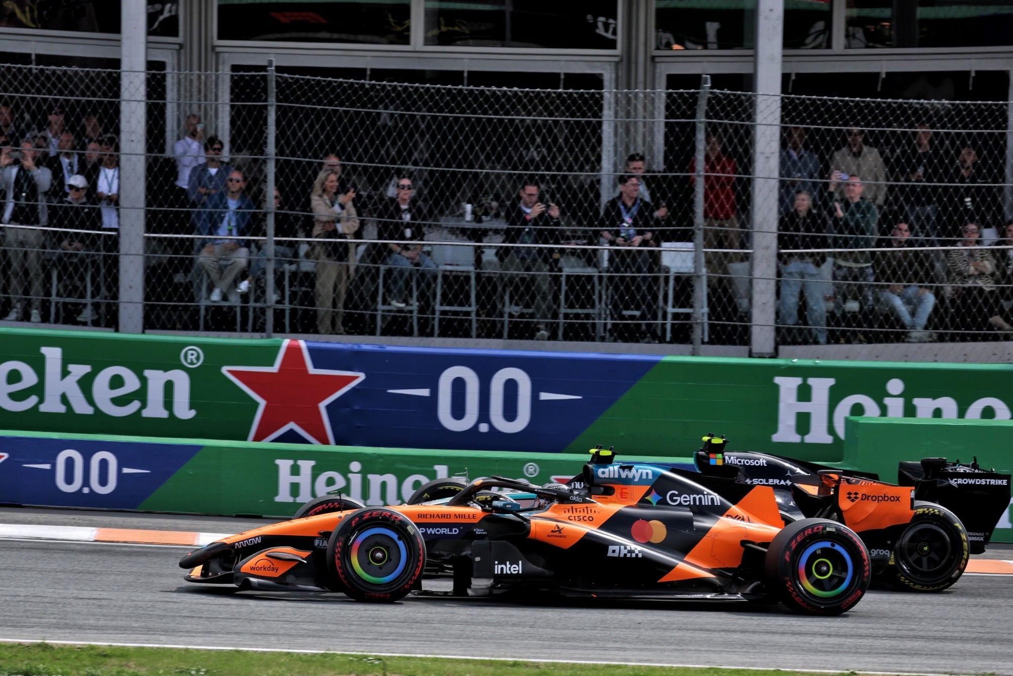 Lando Norris (GBR) McLaren F1 Team MCL40 and Andrea Kimi Antonelli (ITA) Mercedes AMG Formula One Team W17 battle for the lead at the start of the race.