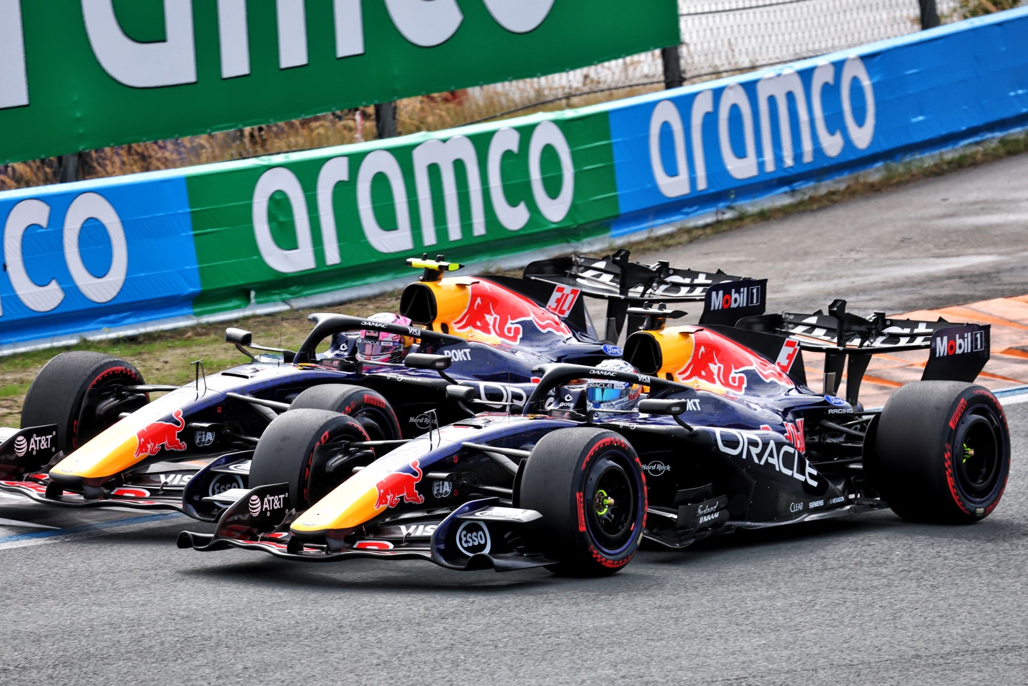 Liam Lawson (NZL) Red Bull Racing RB22 and Max Verstappen (NLD) Red Bull Racing RB22 battle for position.