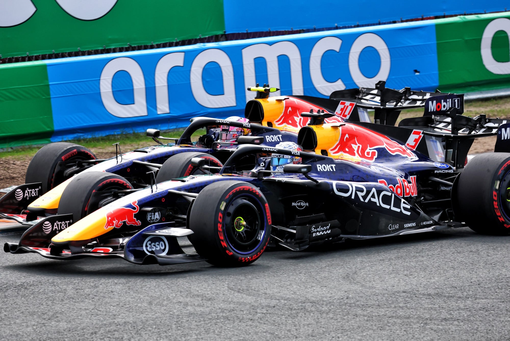 Liam Lawson (NZL) Red Bull Racing RB22 and Max Verstappen (NLD) Red Bull Racing RB22 battle for position.