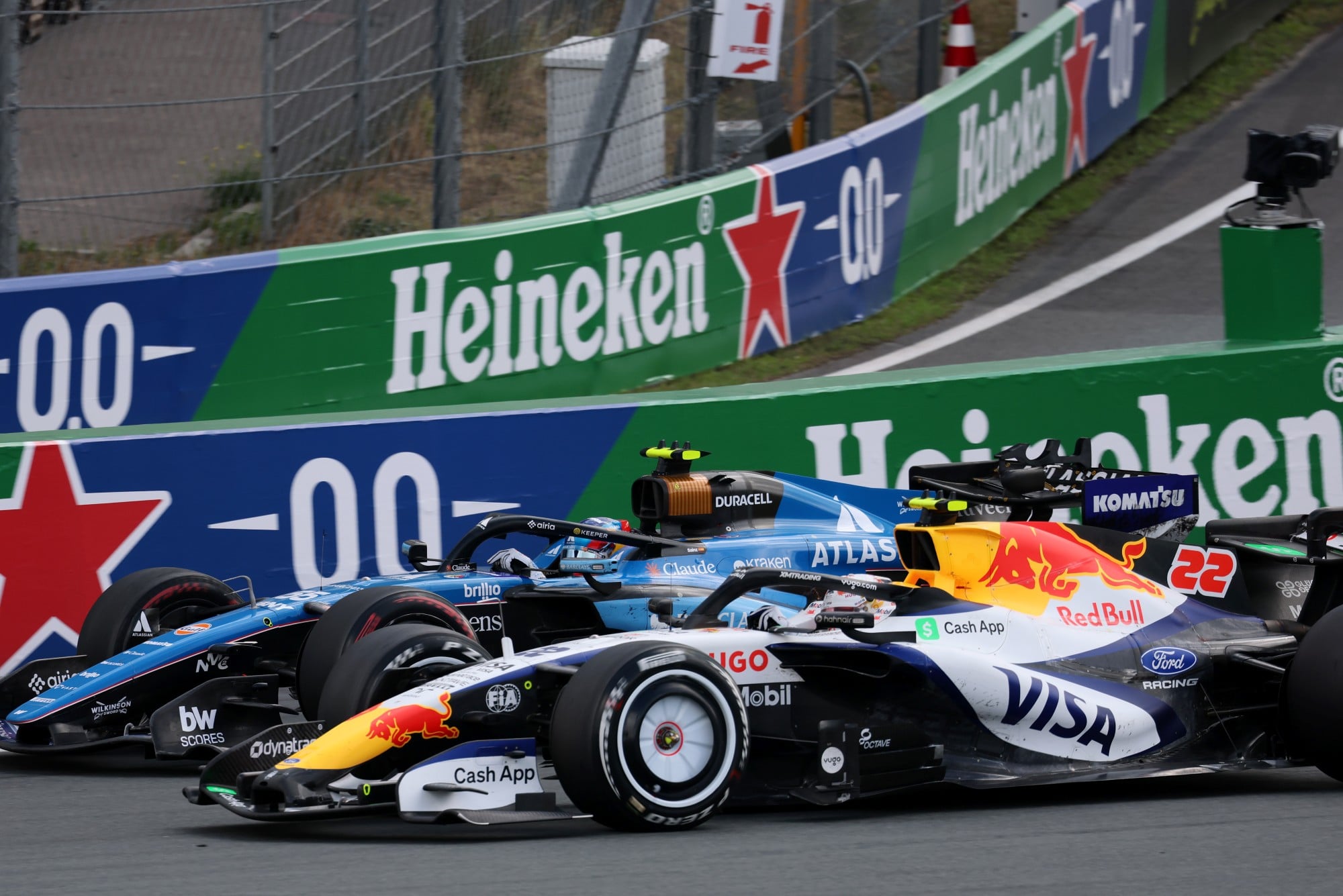 Carlos Sainz (ESP) Williams F1 Team FW48 and Yuki Tsunoda (JPN) Racing Bulls Formula One Team VCARB 03 Reserve Driver battle for position.